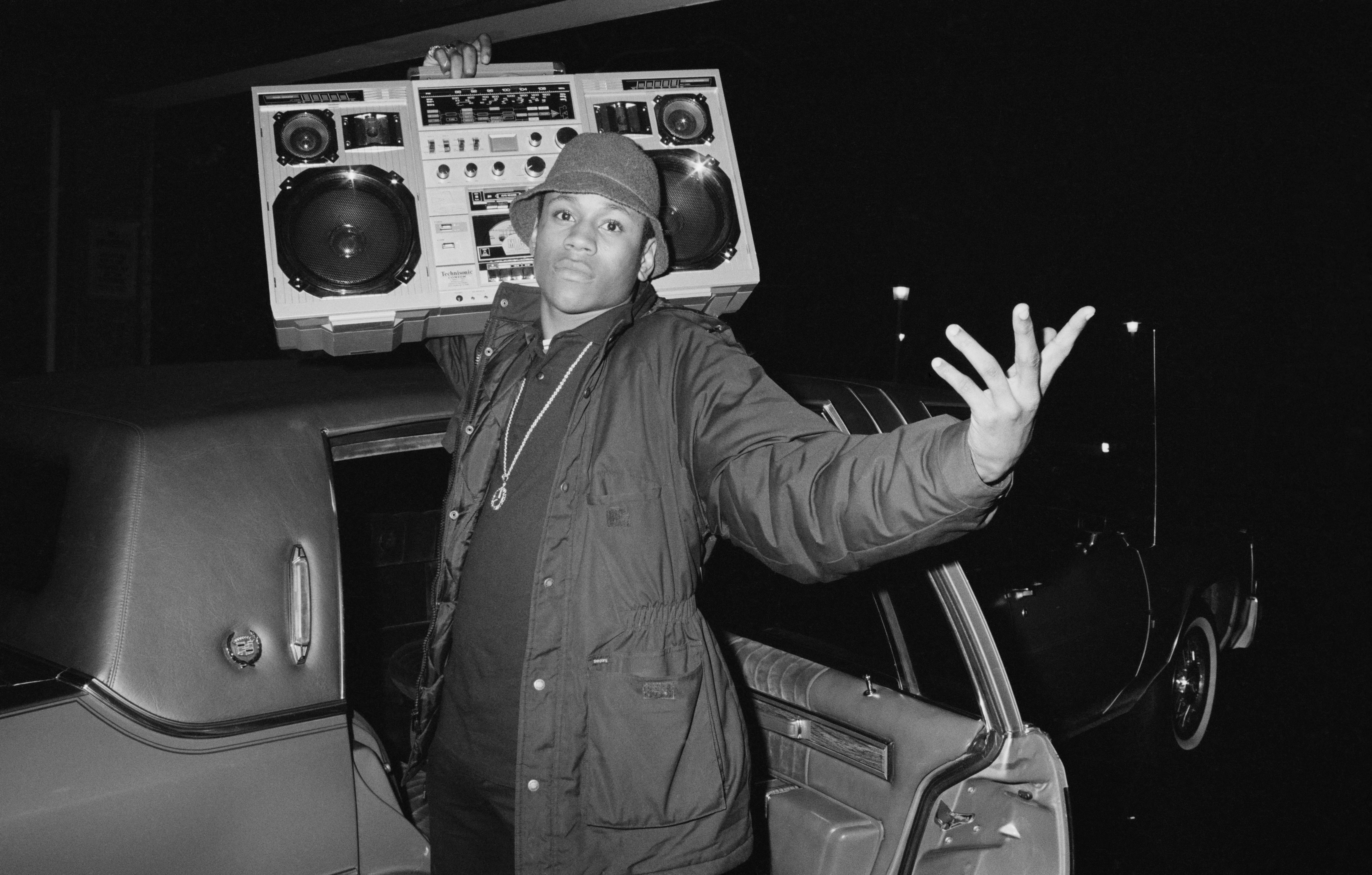 Rapper LL Cool J holds a boombox outside a concert in 1986. | Source: Michael Ochs Archives/Getty Images