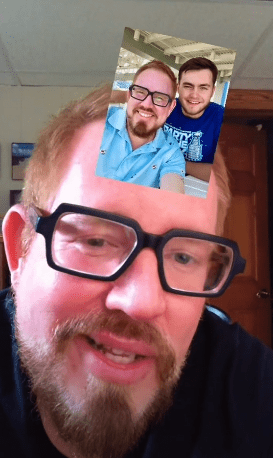 toddler83 showing a picture of himself with his son during the TikTok | Photo: Tiktok.com/@toddler83