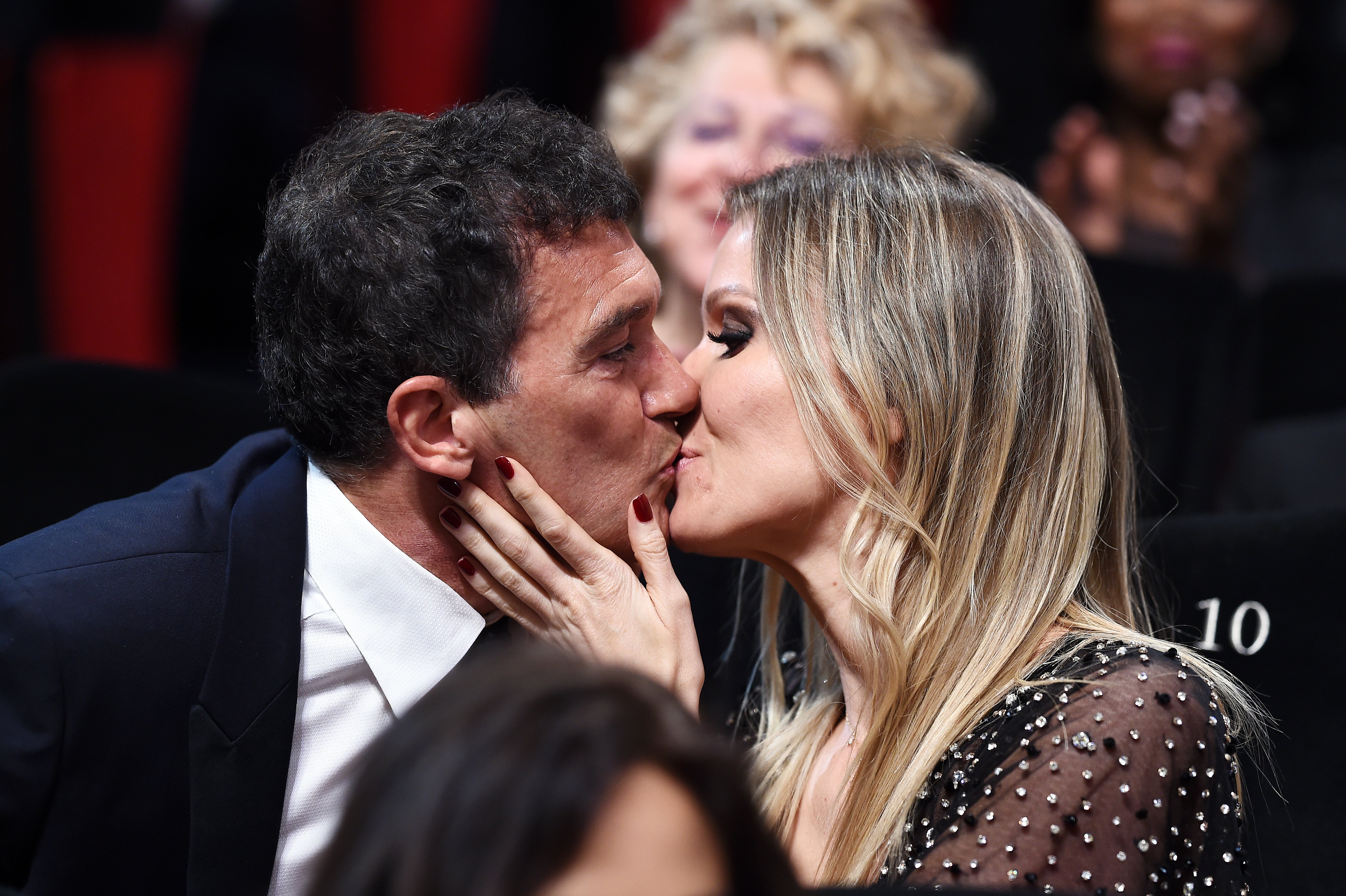 Antonio Banderas and Nicole Kimpel embrace after winning the Best Actor award for his role in "Dolor Y Gloria" at the Closing Ceremony during the 72nd annual Cannes Film Festival on May 25, 2019 in Cannes, France | Source: Getty Images 