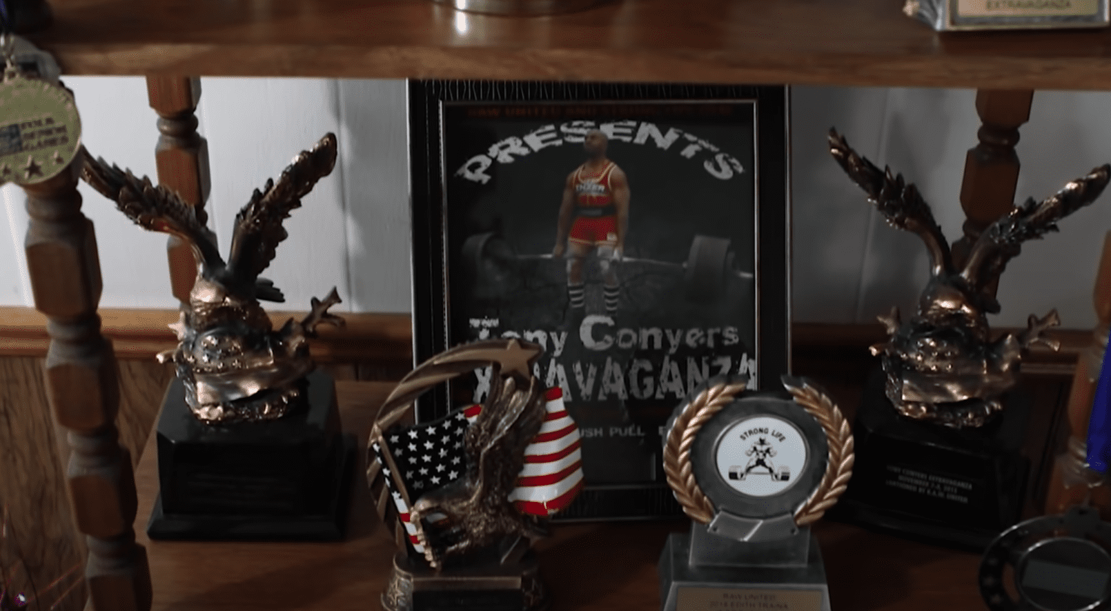 100-year-old woman's powerlifting trophies stand on her cabinet | Photo: Youtube/Guinness World Records
