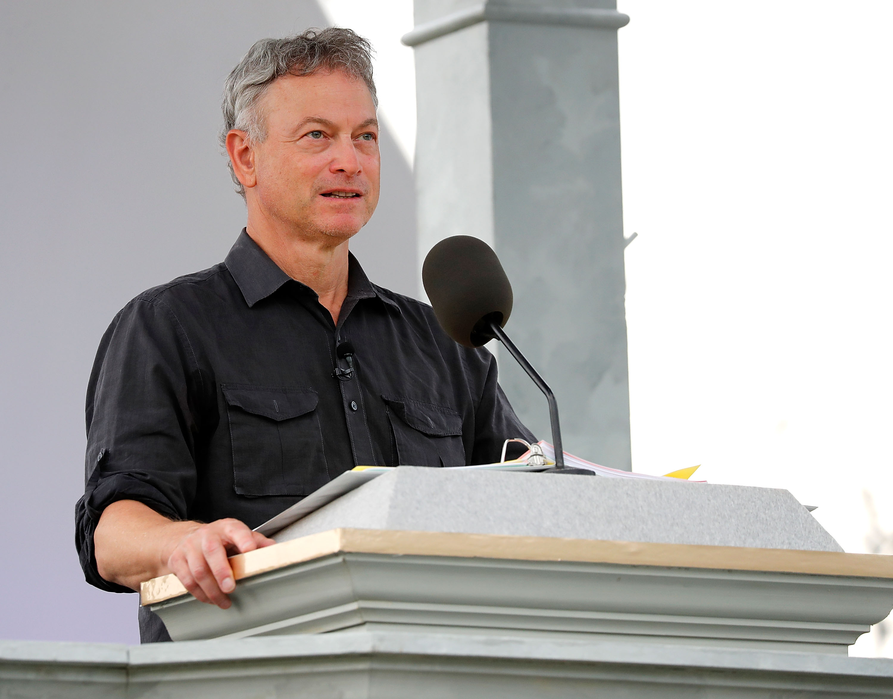 Gary Sinise speaking during the 2018 National Memorial Day Concert rehearsals at the U.S. Capitol West Lawn on May 26, 2018 in Washington, D.C. | Source: Getty Images