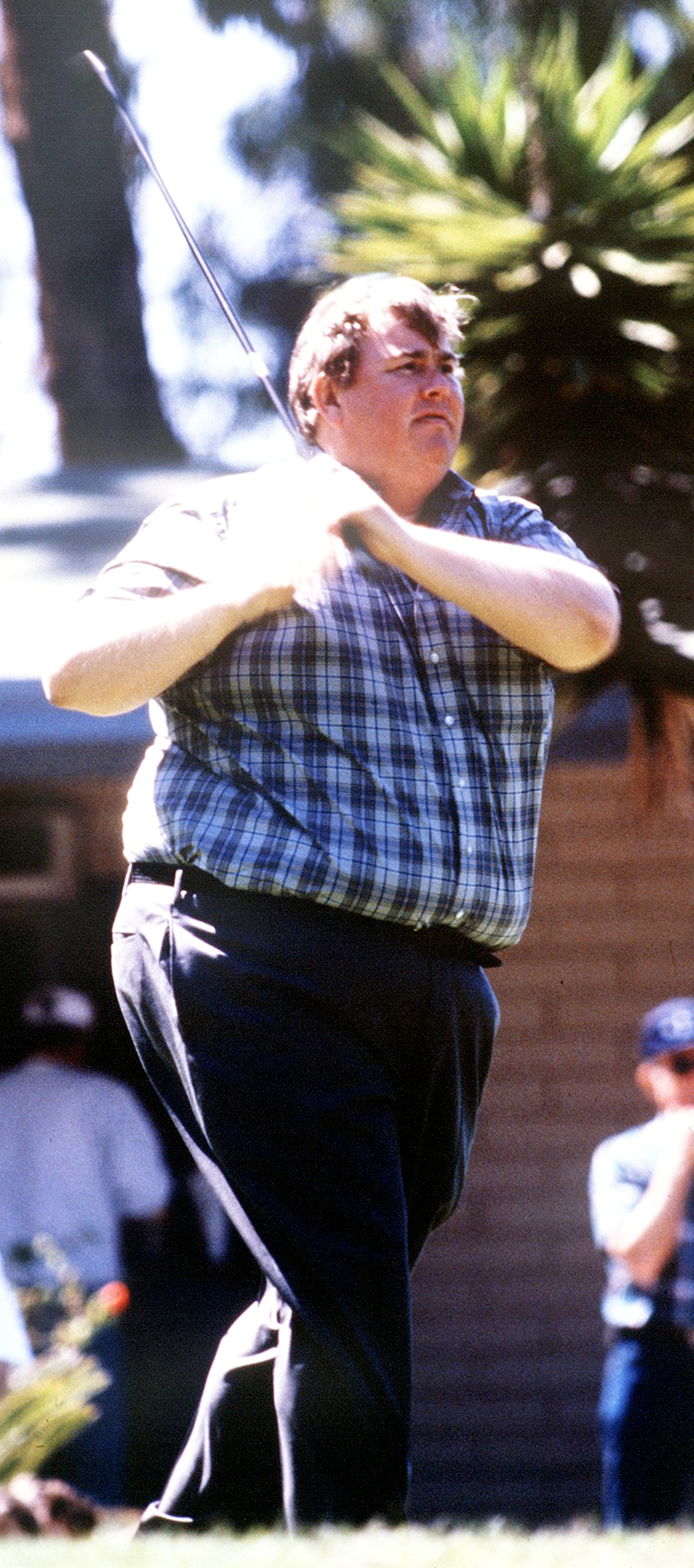 John Candy playing golf, circa 1990 | Source: Getty Images