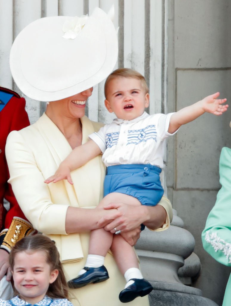 Duchess of Cambridge and Prince Louis of Cambridge watch a flypast from the balcony of Buckingham Palace during Trooping The Colour on June 8, 2019, in London, England. | Source: Getty Images.