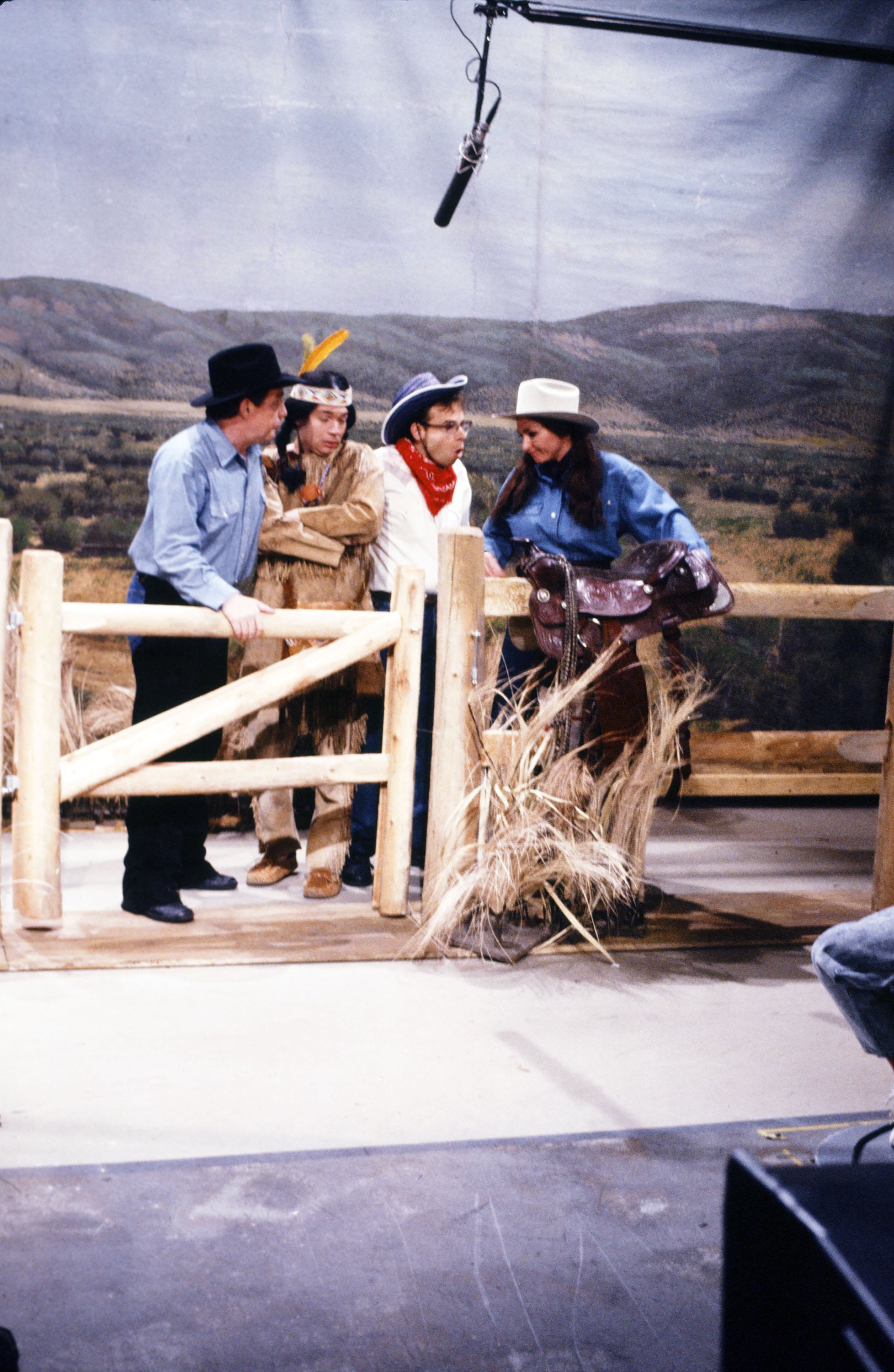(L-R) Phil Hartman as Chet Masters, Mike Myers as Indian Boy, Rick Moranis as Jimmy, Nora Dunn as Ms. Parsons during the "Wild Horse" skit in "Saturday Night Live" on October 7, 1989. | Source: Getty Images