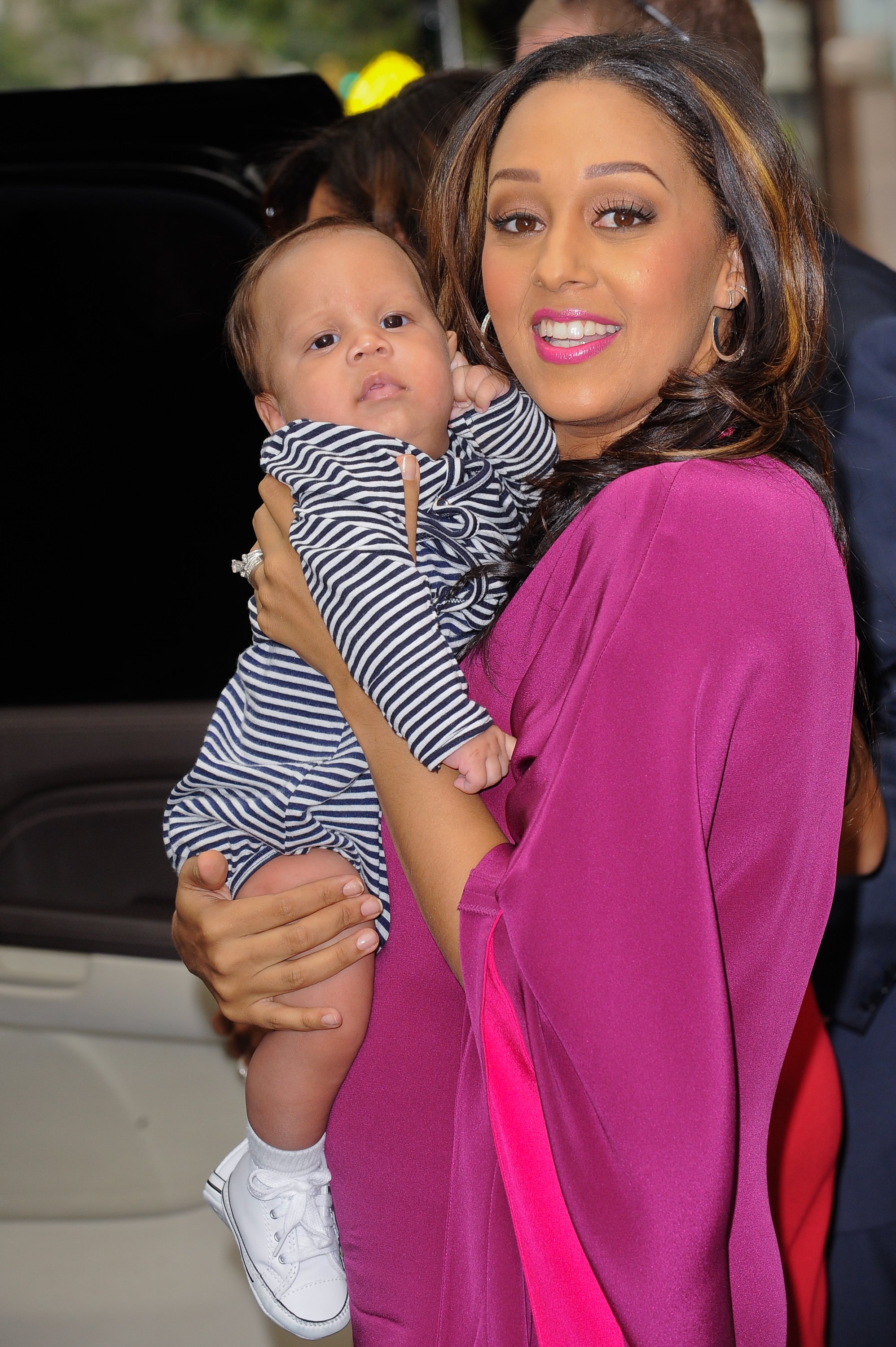 Tia Mowry and son Cree Hardrict leave the "Wendy Williams Show" set in New York City on September 27, 2011 | Photo: Getty Images