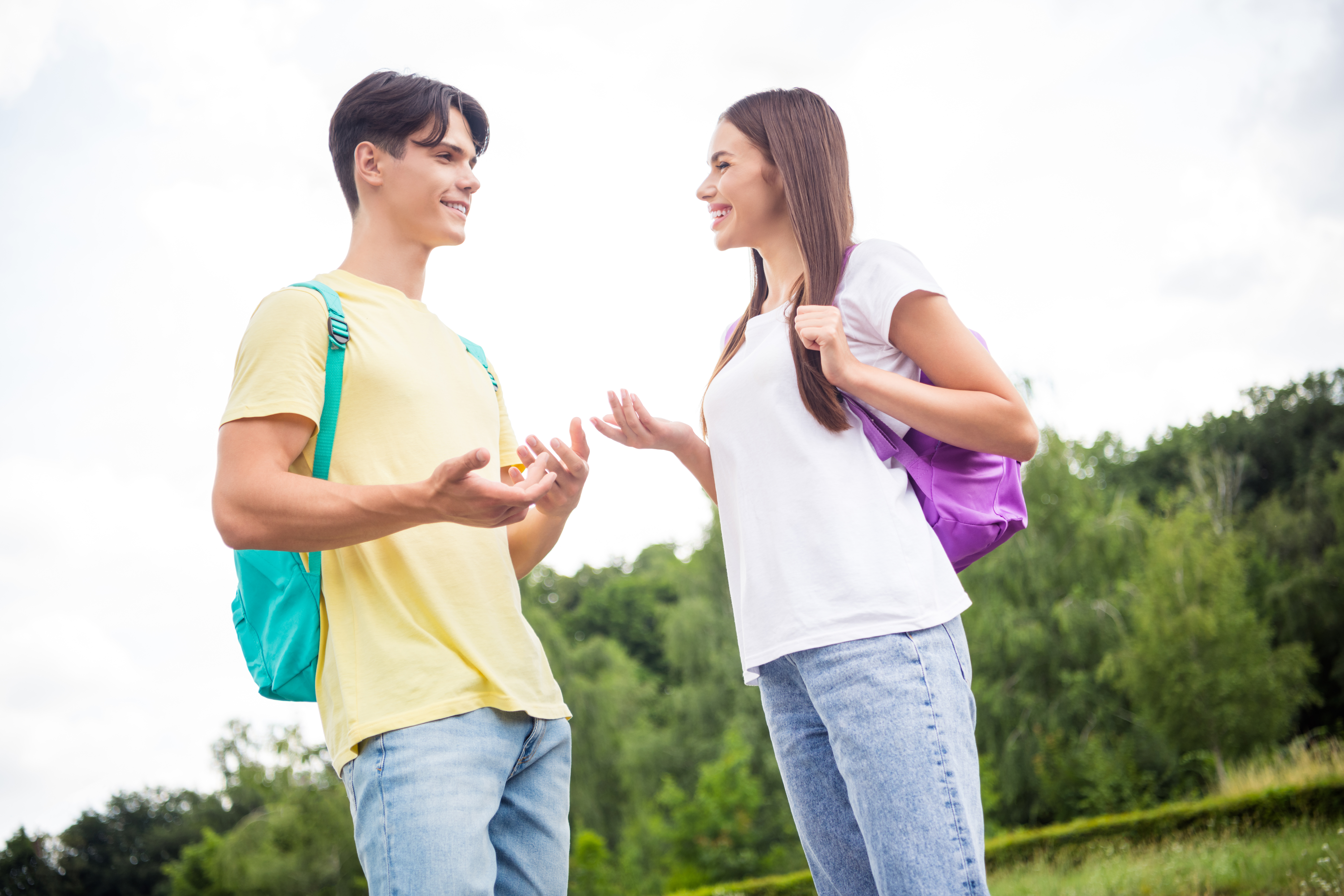 High school boy and girl talking. | Source: Shutterstock