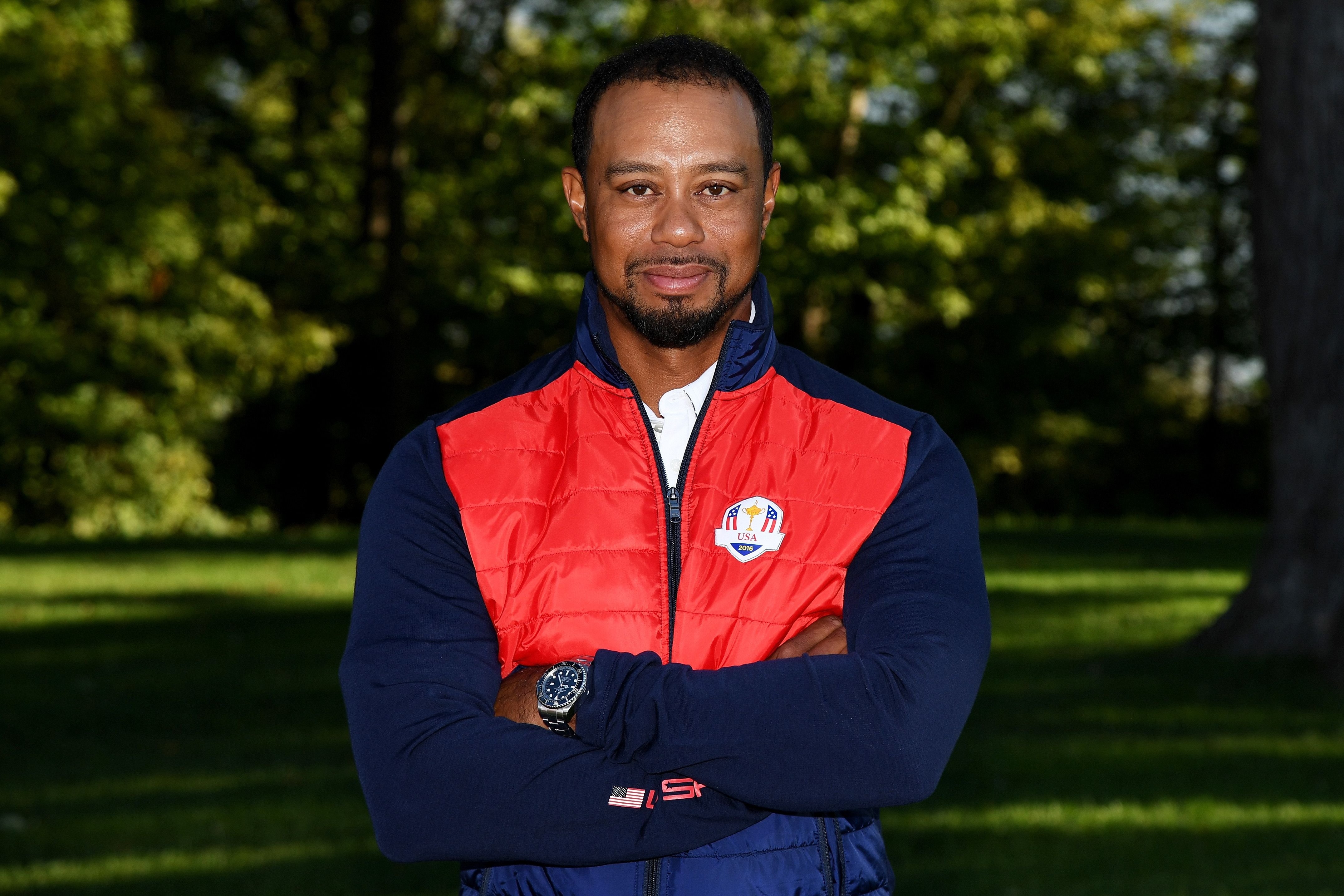 Tiger Woods poses during team photocalls prior to the 2016 Ryder Cup at Hazeltine National Golf Club on September 27, 2016 in Chaska, Minnesota. | Source: Getty Images