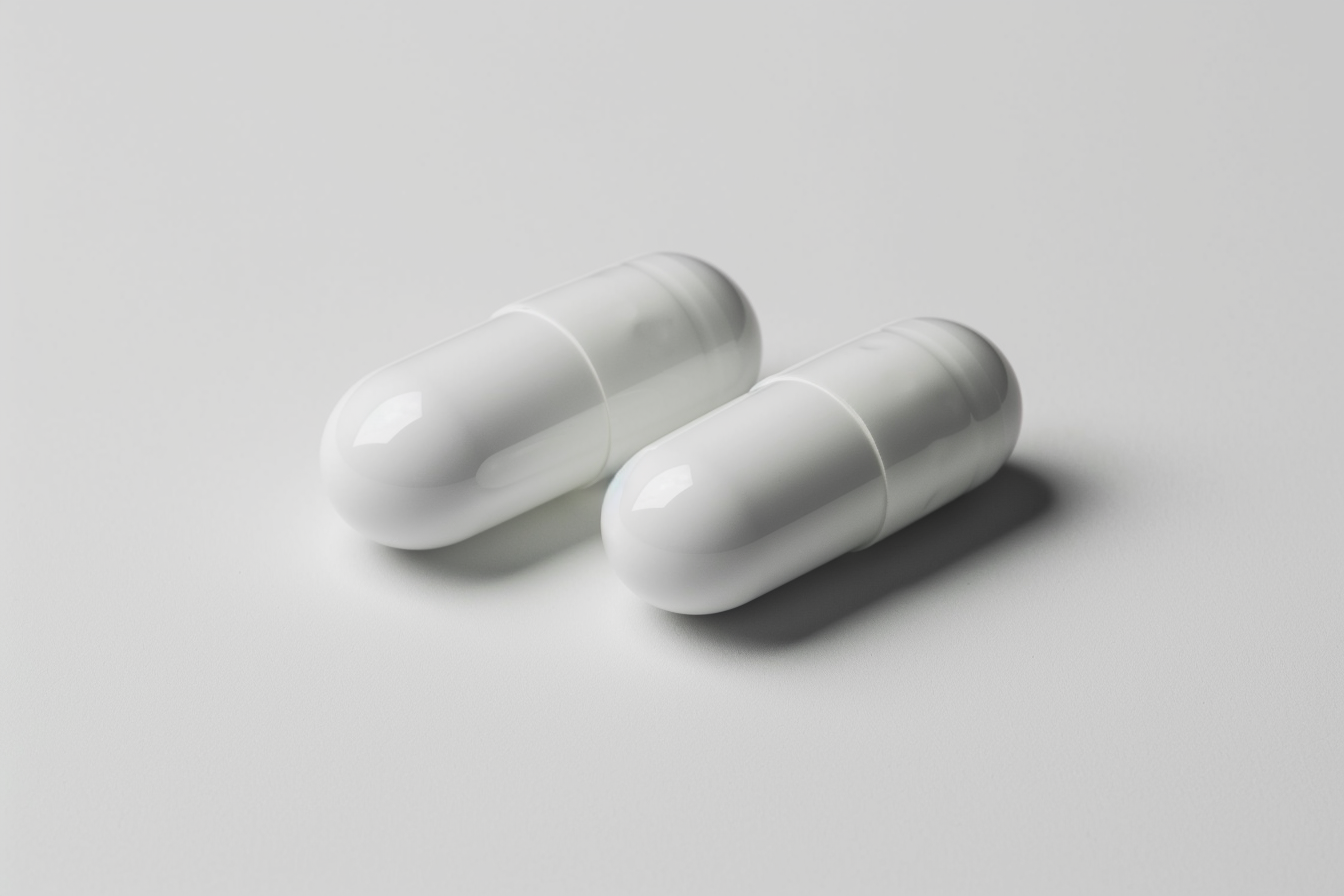 Two white pills | Source: Midjourney