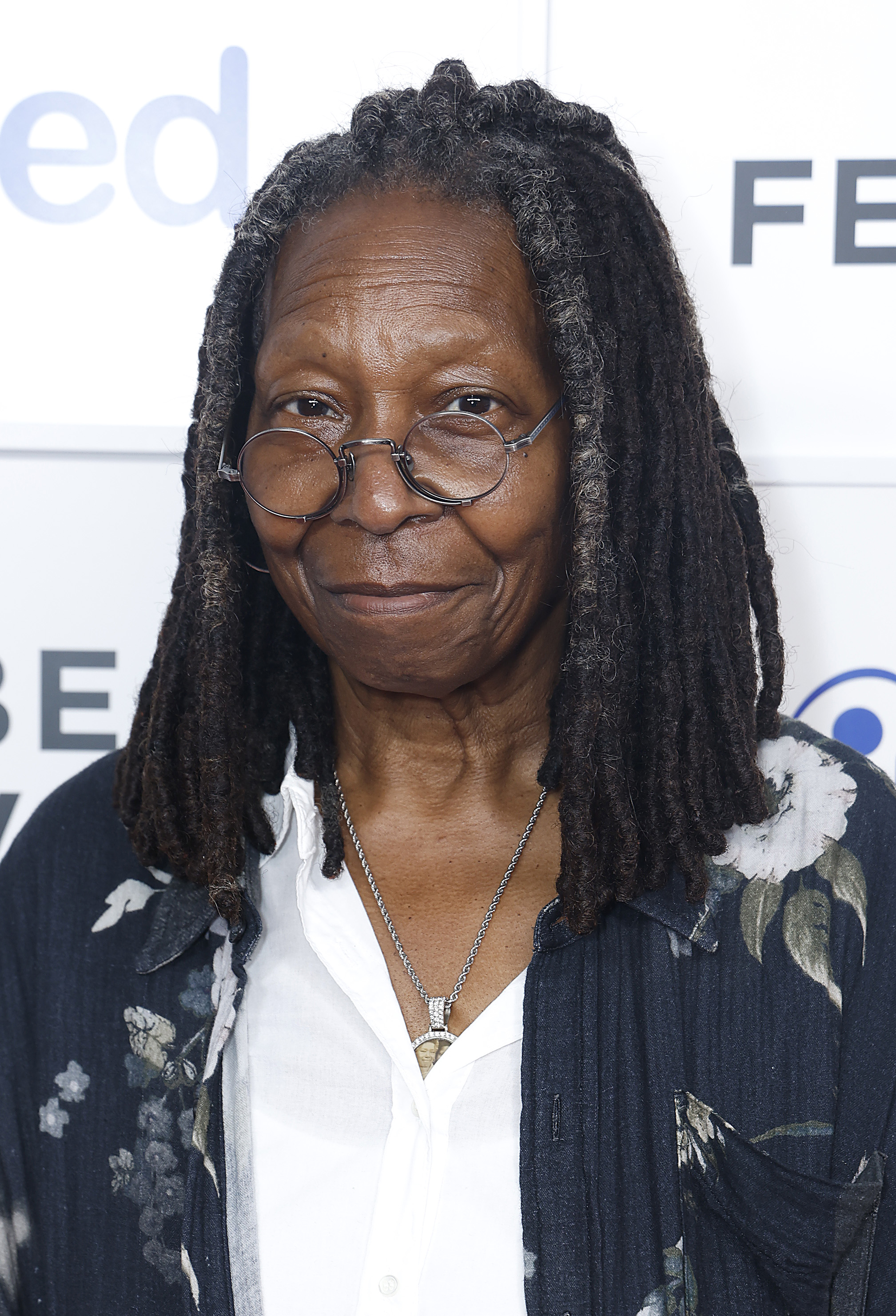 Goldberg, also 69, appeared at the Tribeca Festival in New York with her signature ease and authenticity. Dressed in a floral-print cardigan over a crisp white shirt, and framed by long locs and round glasses, she embraced comfort without sacrificing individuality — leaning into a look that felt lived-in, grounded, and unmistakably her own.