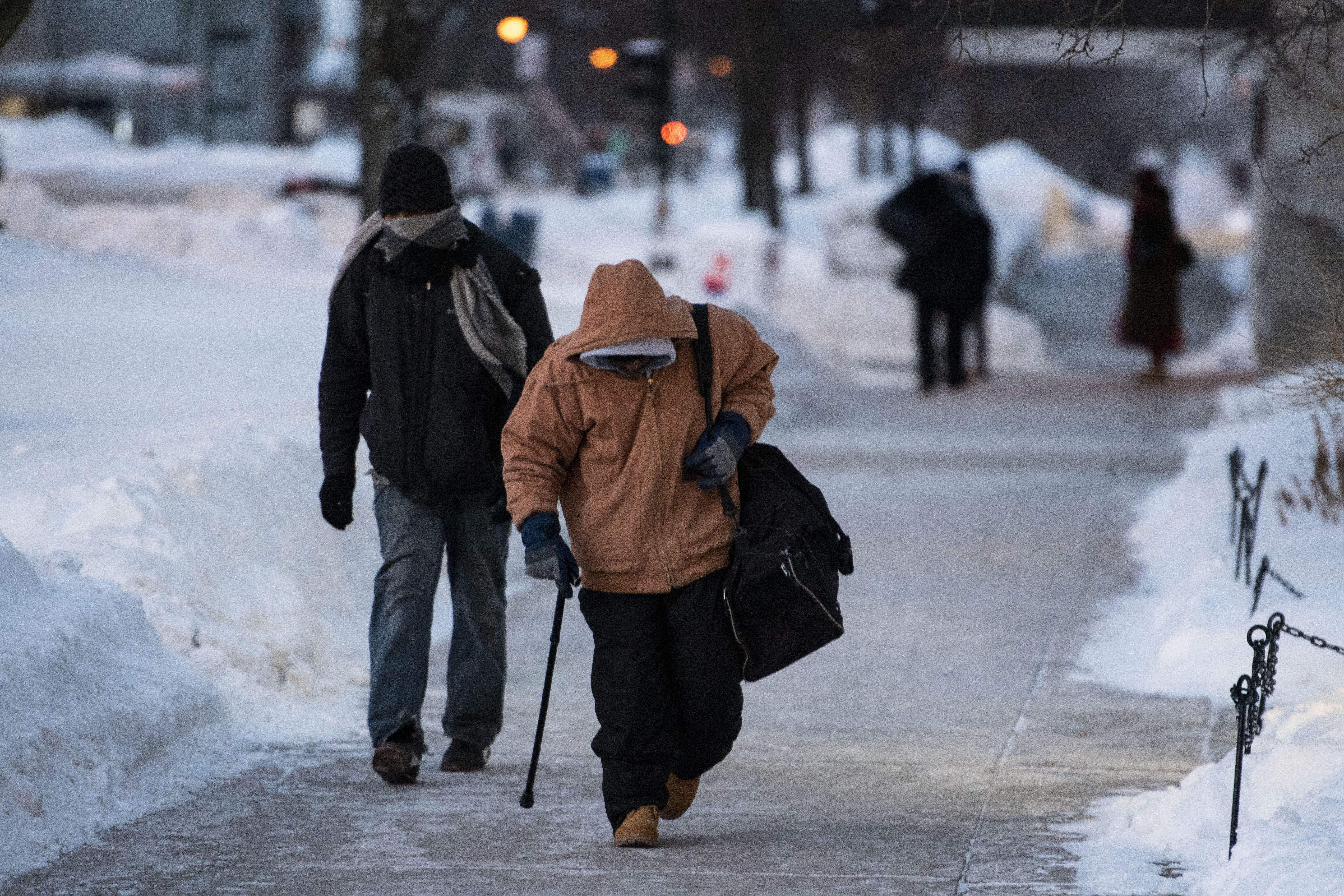 Men walk in chilly weather in Madison, Wisconsin, on January 30, 2019 | Source: Getty Images