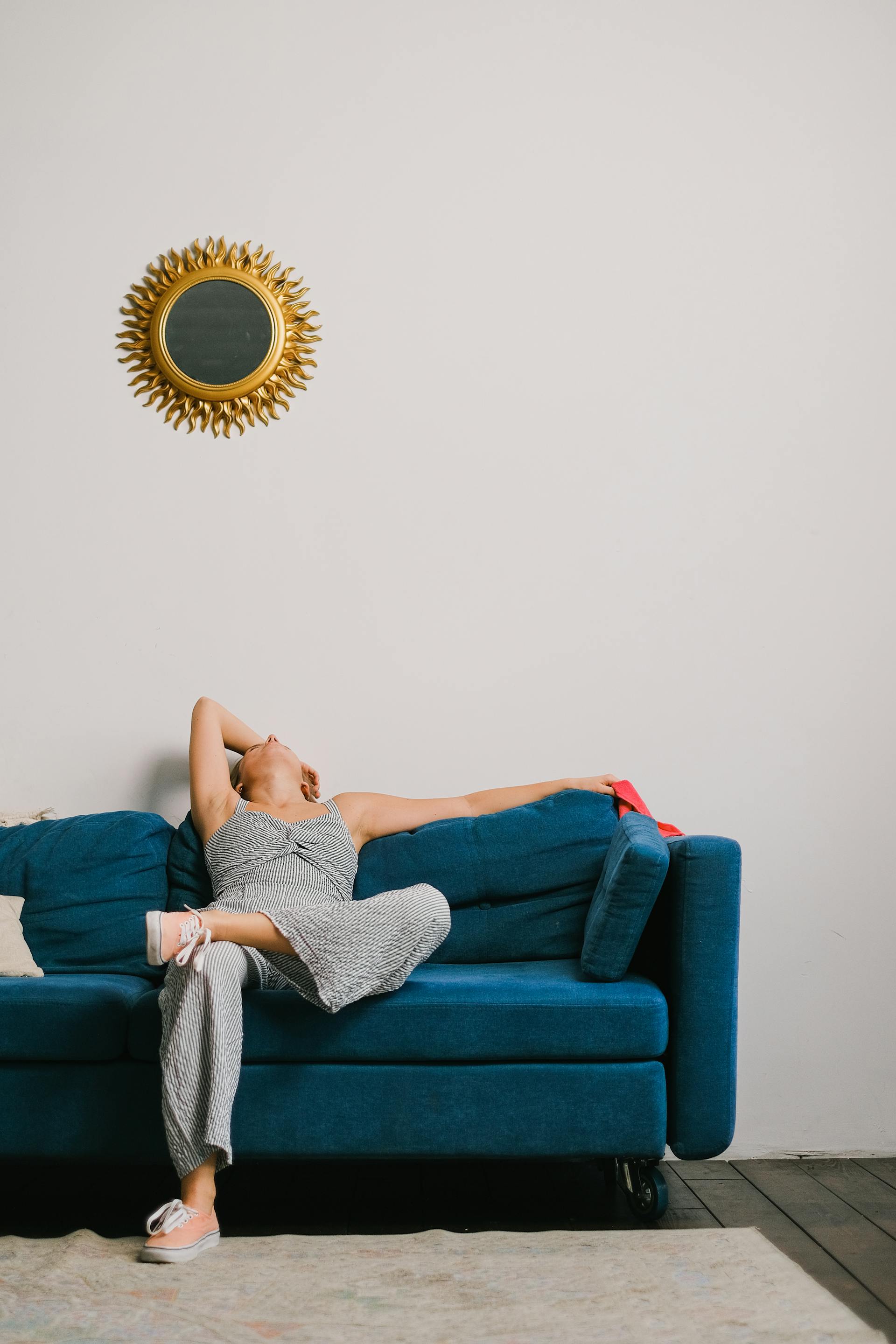 An exhausted woman resting on the sofa | Source: Pexels