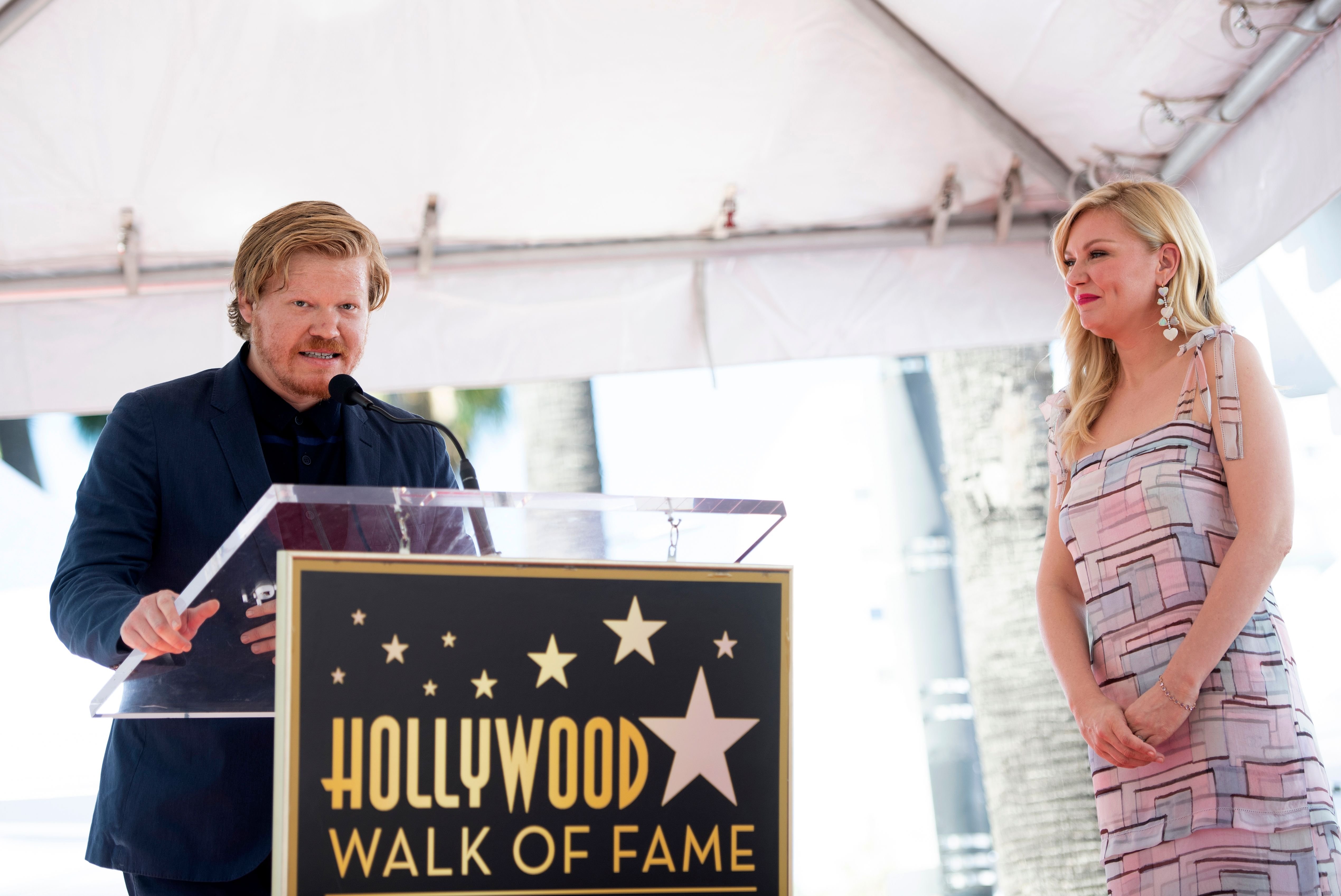 Jesse Plemons giving a speech as Kirsten Dunst receives her star on the Hollywood Walk of Fame on August 29, 2019 | Source: Getty Images