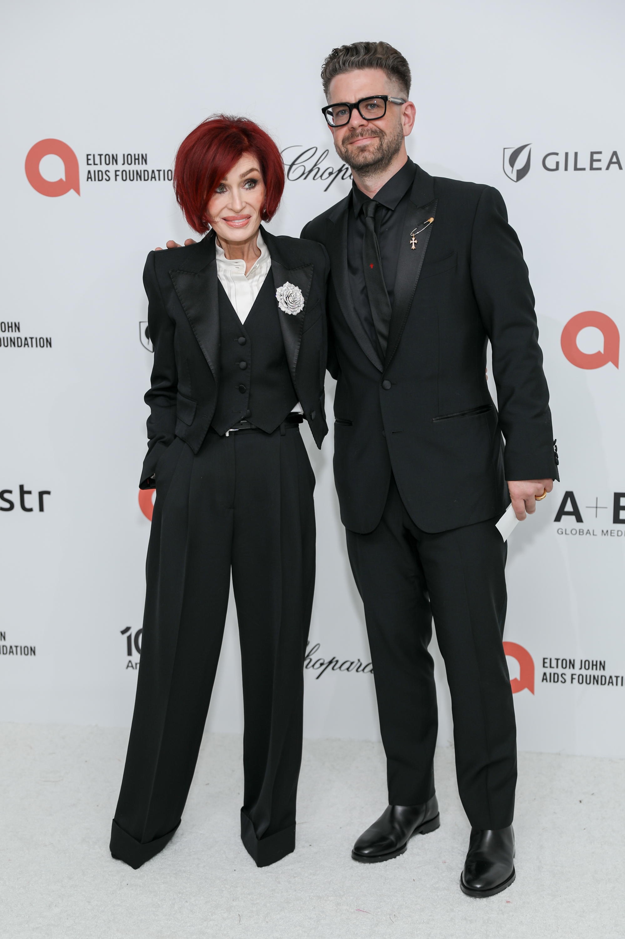 Sharon Osbourne and her son Jack Osbourne attend the Elton John AIDS Foundation Academy Awards Viewing Party in West Hollywood, California, on March 15, 2026. Jack previously reassured fans that his mother was recovering after her unexplained hospitalization in 2022. | Source: Getty Images