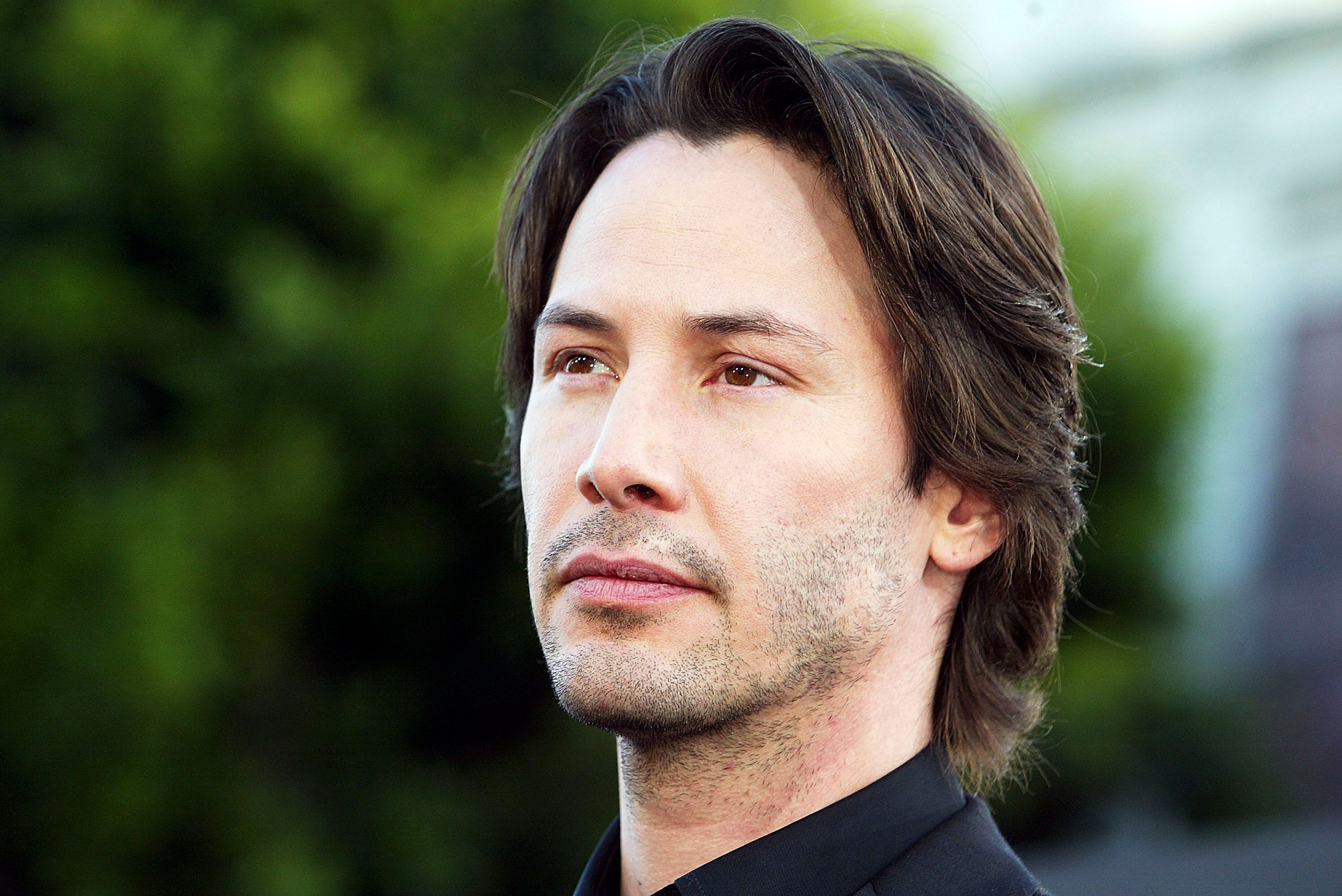 Keanu Reeves arrives at the premiere of "The Matrix Reloaded" at the Village Theater | Getty Images