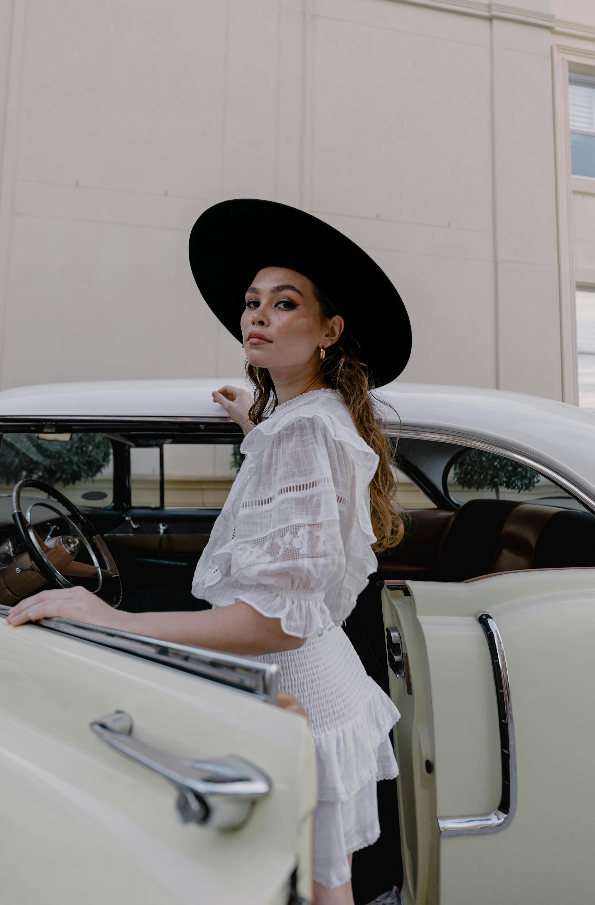 A woman standing beside a car | Source: Pexels