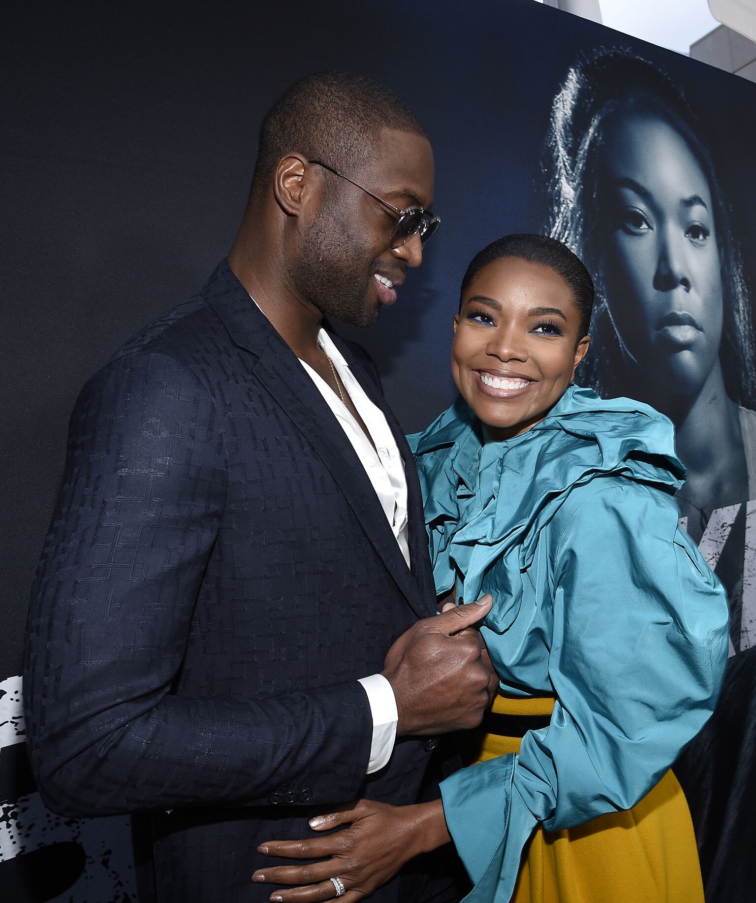 Gabrielle Union and her husband basketball player for the Miami Heat Dwyane Wade arrive for Universal Pictures' special screening of the film "Breaking In" at ArcLight Cinemas | Getty Images