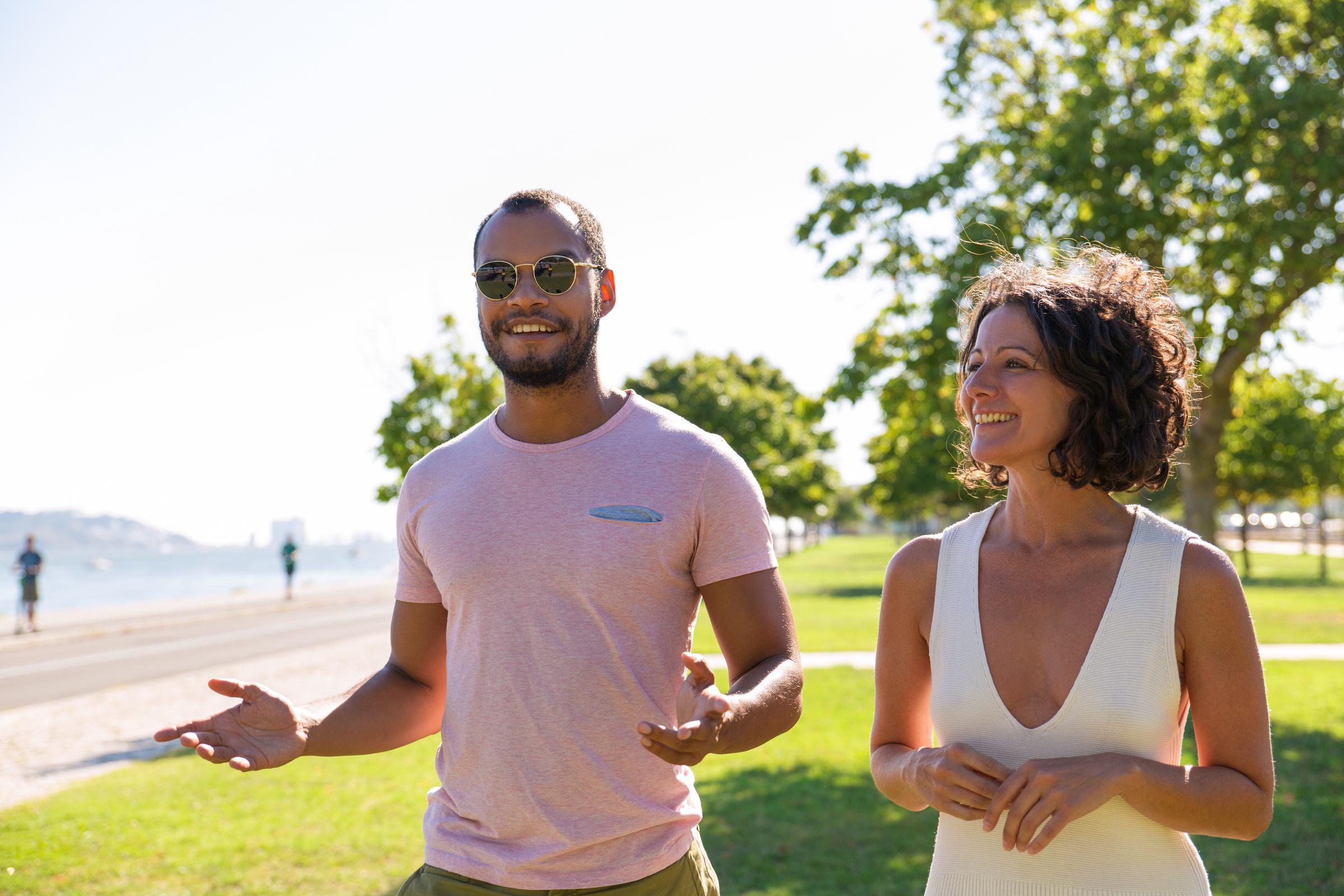 A man and a woman walking in the park | Source: Shutterstock