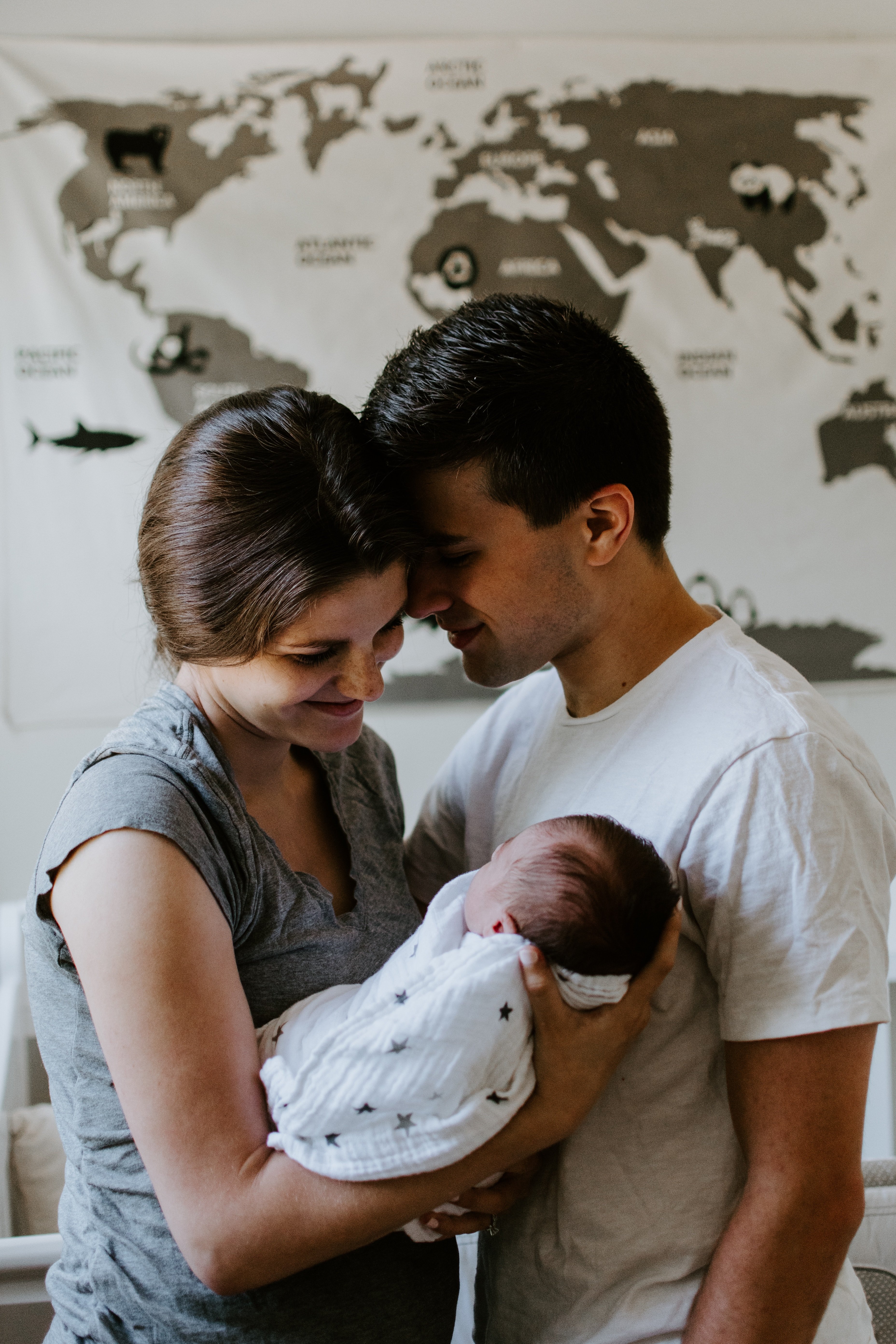 Proud parents holding a newborn baby | Source: Unsplash.com