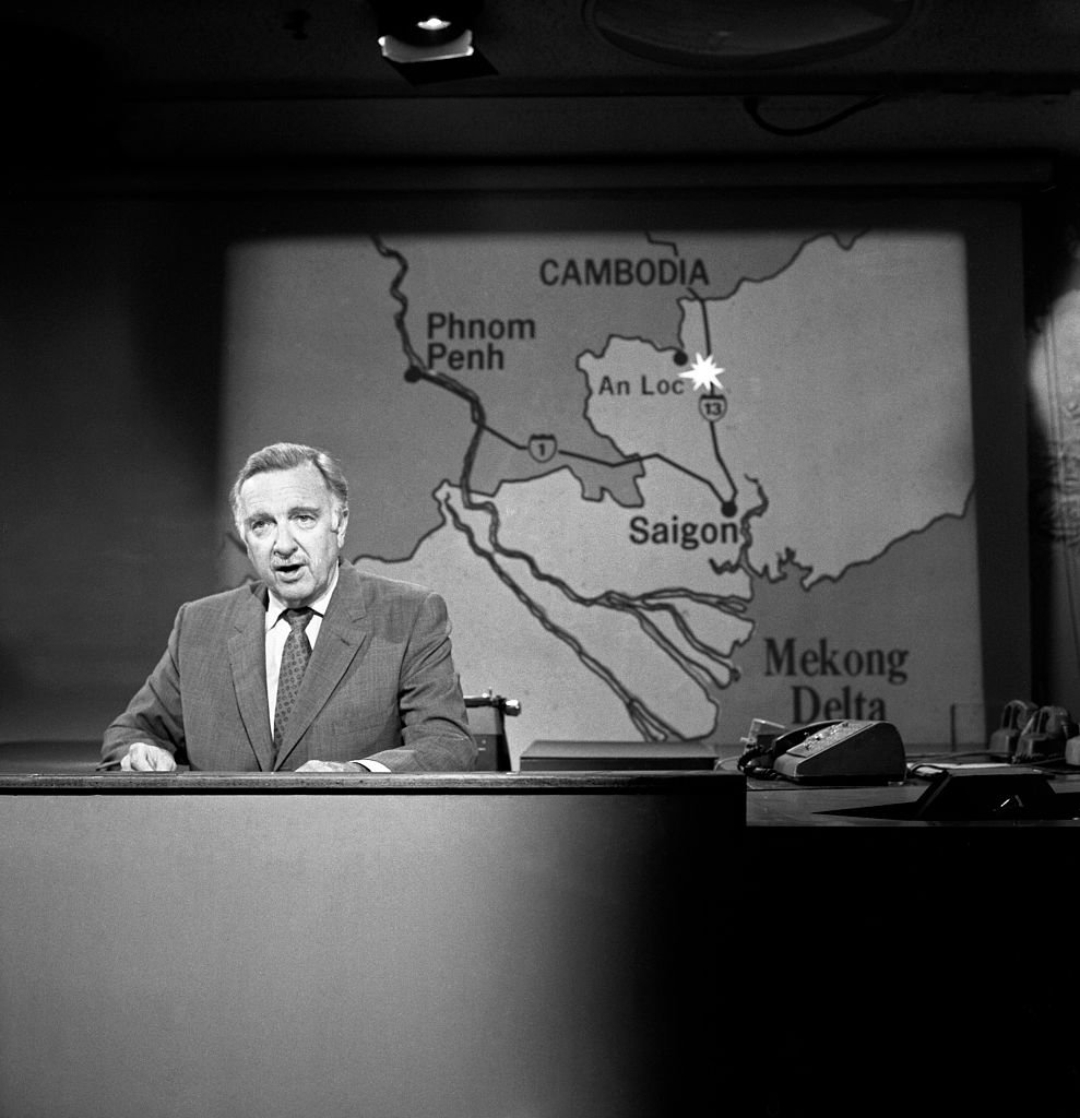 Walter Cronkite, at the CBS News desk, reports on the war in Vietnam. | Source: Getty Images