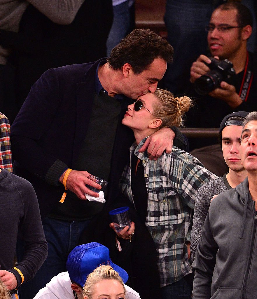 Mary-Kate Olsen and Olivier Sarkozy attend the New York Knicks vs Minnesota Timberwolves game in New York City on November 3, 2013 | Photo: Getty Images