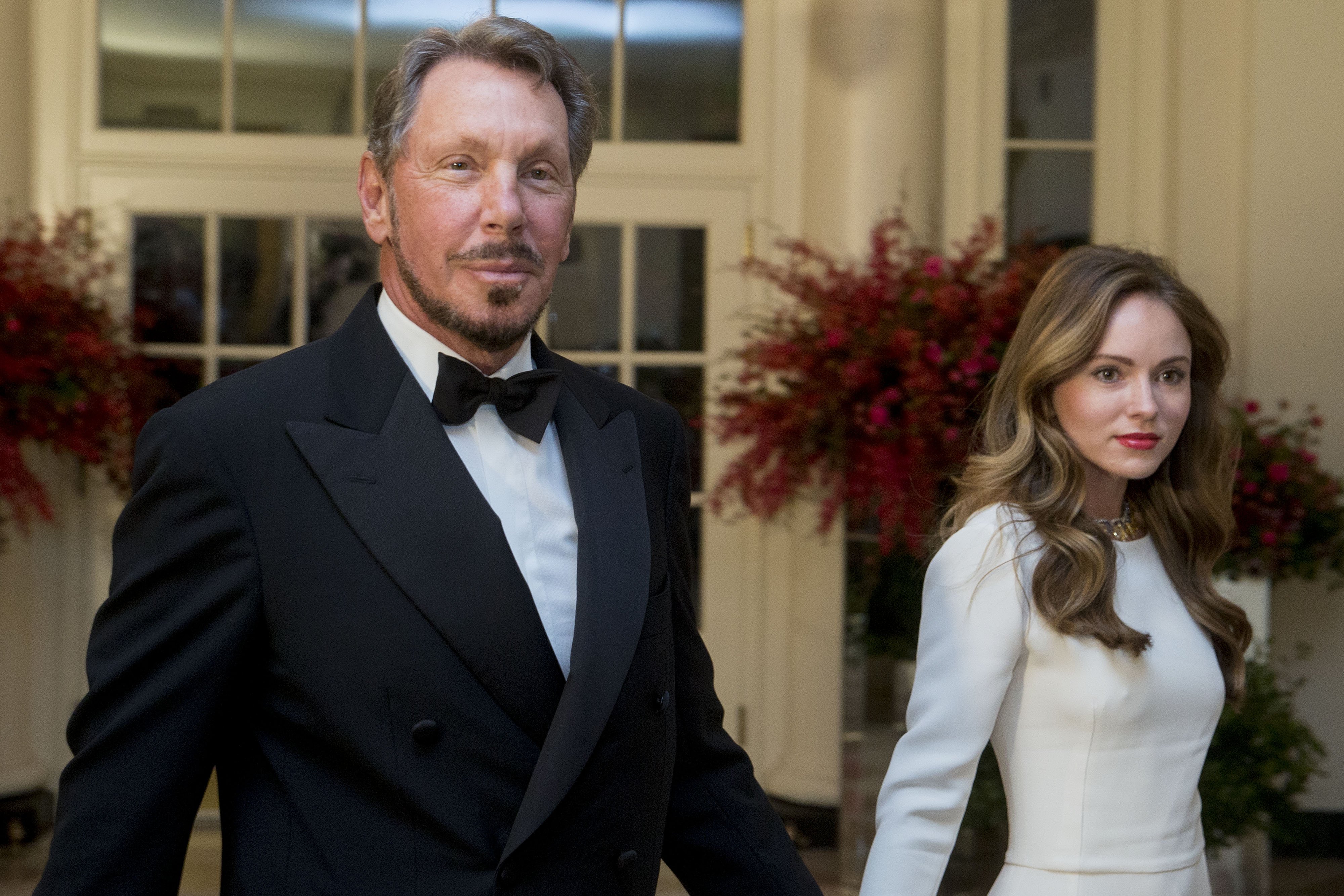 Billionaire Larry Ellison and Nikita Kahn arrive at a state dinner in honor of Chinese President Xi Jinping at the White House in Washington, D.C., U.S., on Friday, Sept. 25, 2015. | Source: Getty Images 