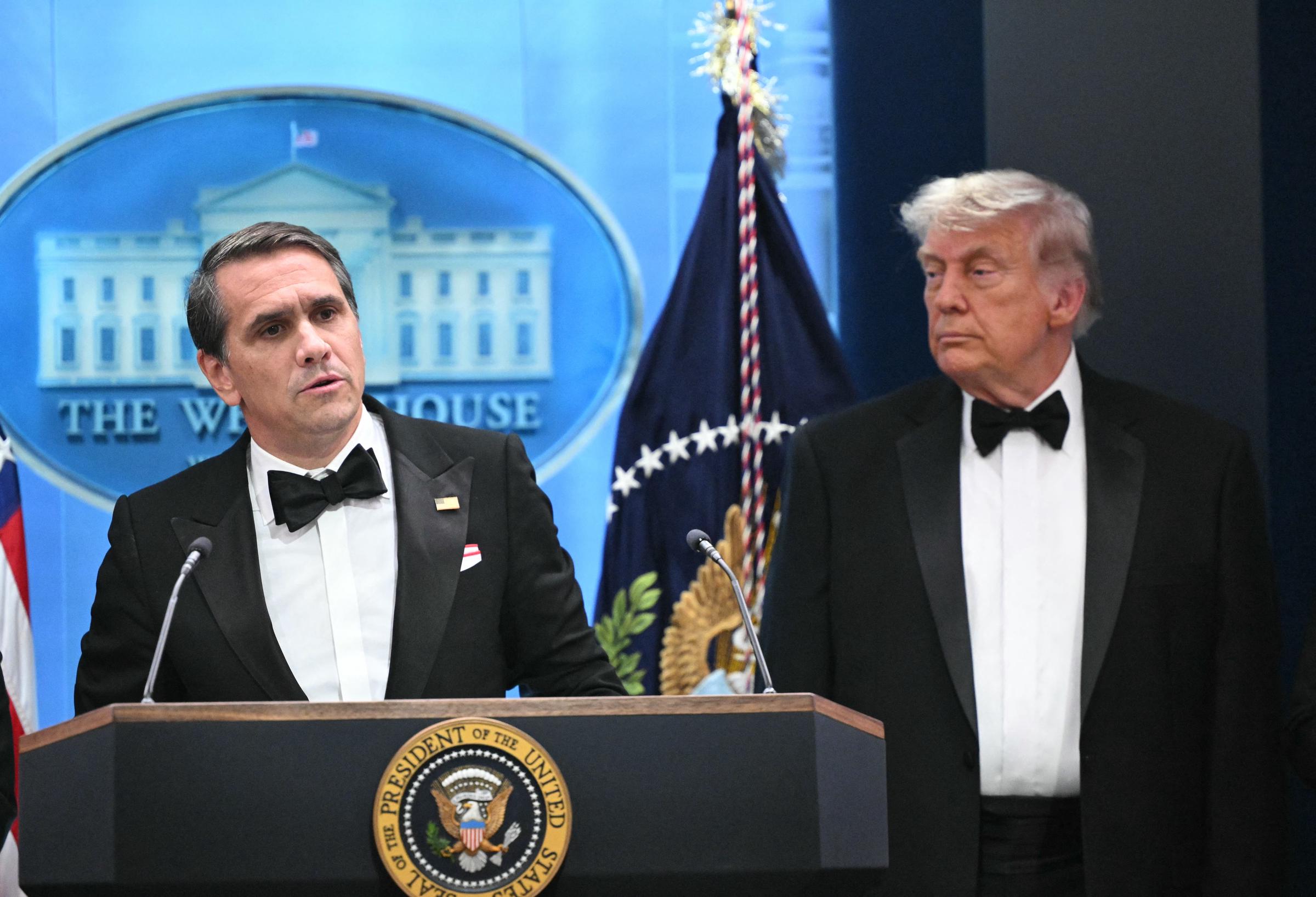 Todd Blanche speaks as Donald Trump listens during a press briefing in the Brady Press Briefing Room at the White House on April 25, 2026, in Washington, DC | Source: Getty Images