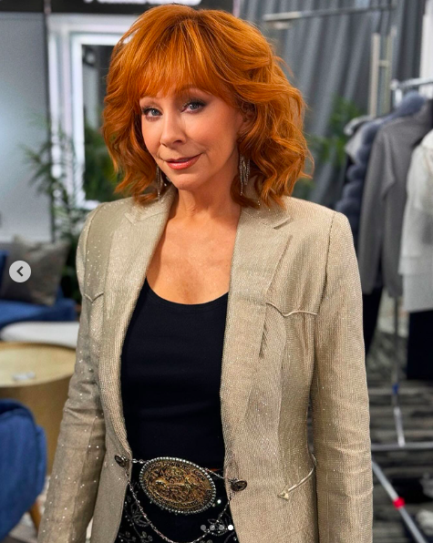 Reba McEntire posing for a picture posted on February 16, 2024 | Source: Instagram/wwd and reba