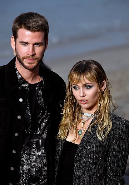 Liam Hemsworth and Miley Cyrus at the Saint Laurent Mens Spring Summer 20 Show on June 06, 2019 | Photo: Getty Images