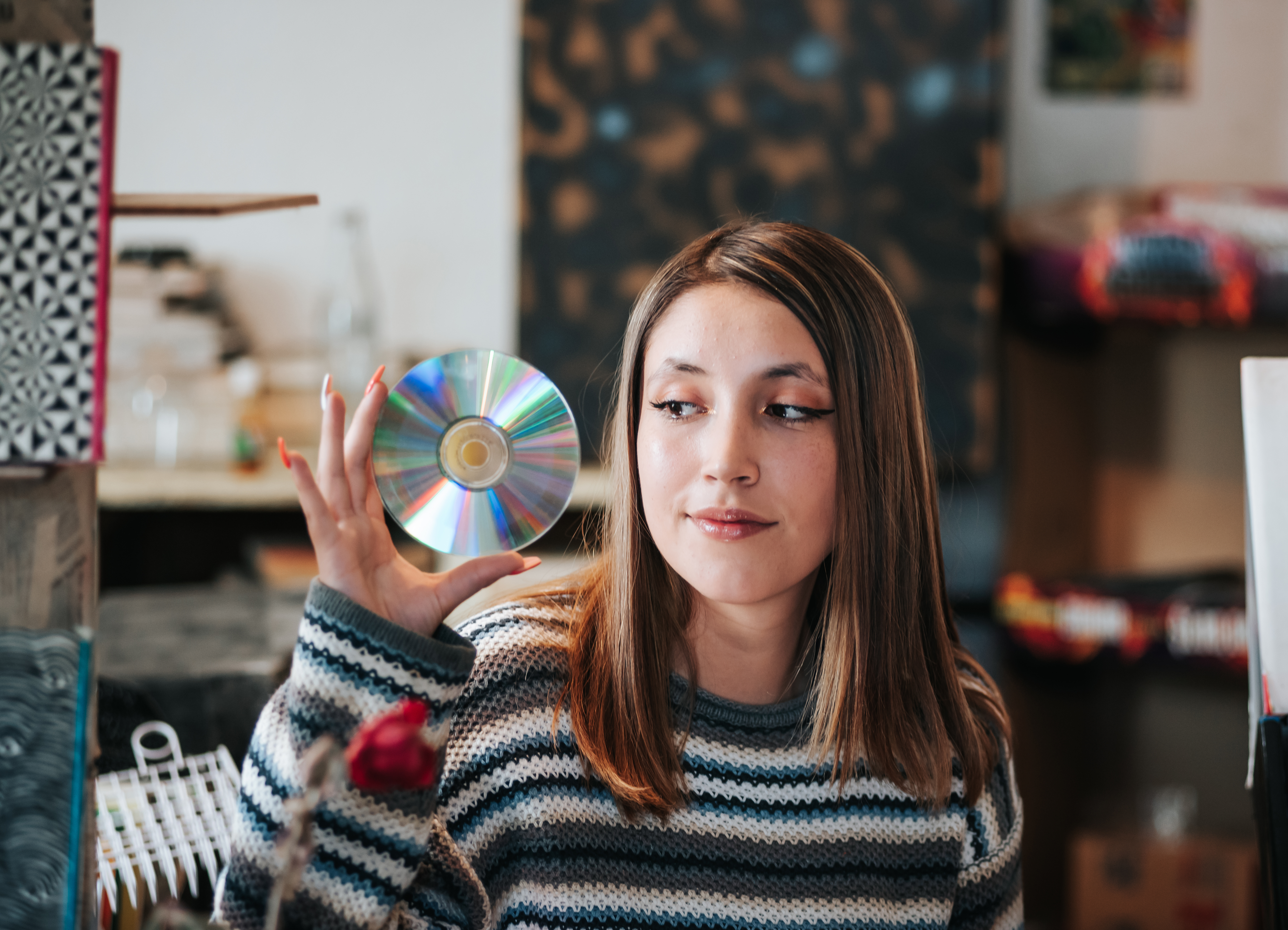 A young woman holding a CD. | Source: Getty Images