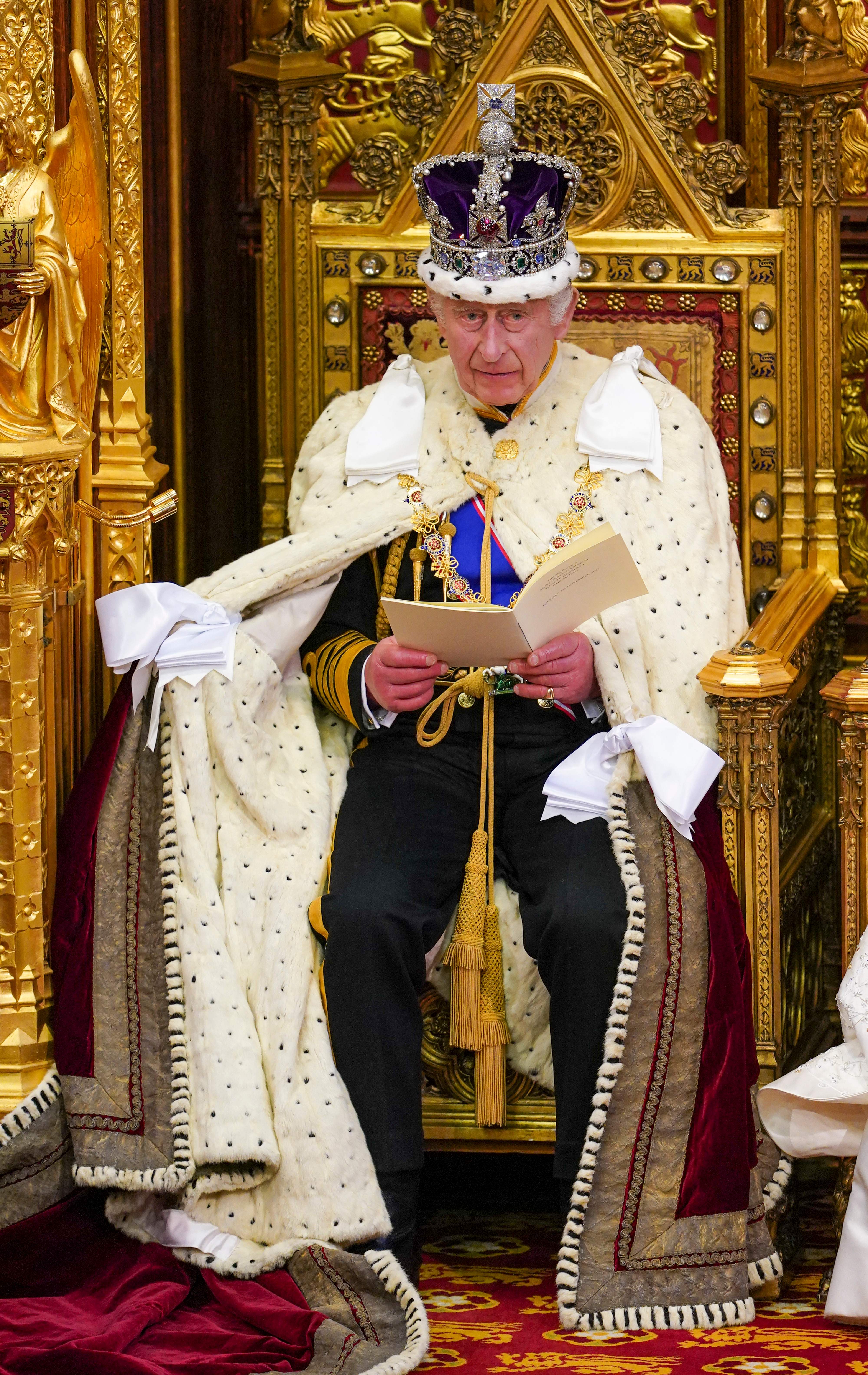 King Charles III reading a speech during the State Opening of Parliament in London, England on November 7, 2023 | Source: Getty Images