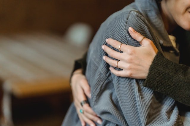 Woman conforting another person with a hug | Source: Pexels