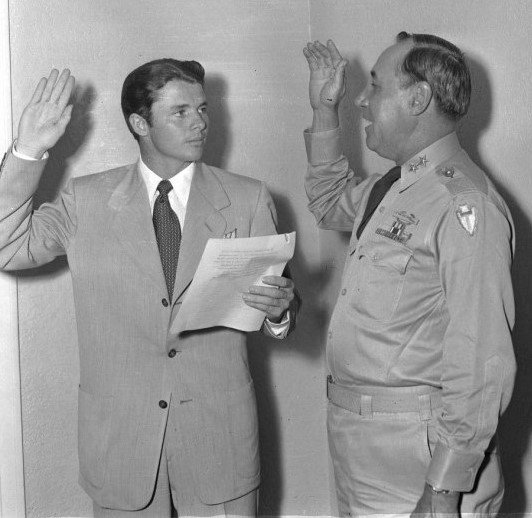 Captain Audie Murphy is sworn in to the Texas National Guard by U. S. Army Major General H. Miller Ainsworth 14 July 1950 | Source: Wikimedia Commons Images