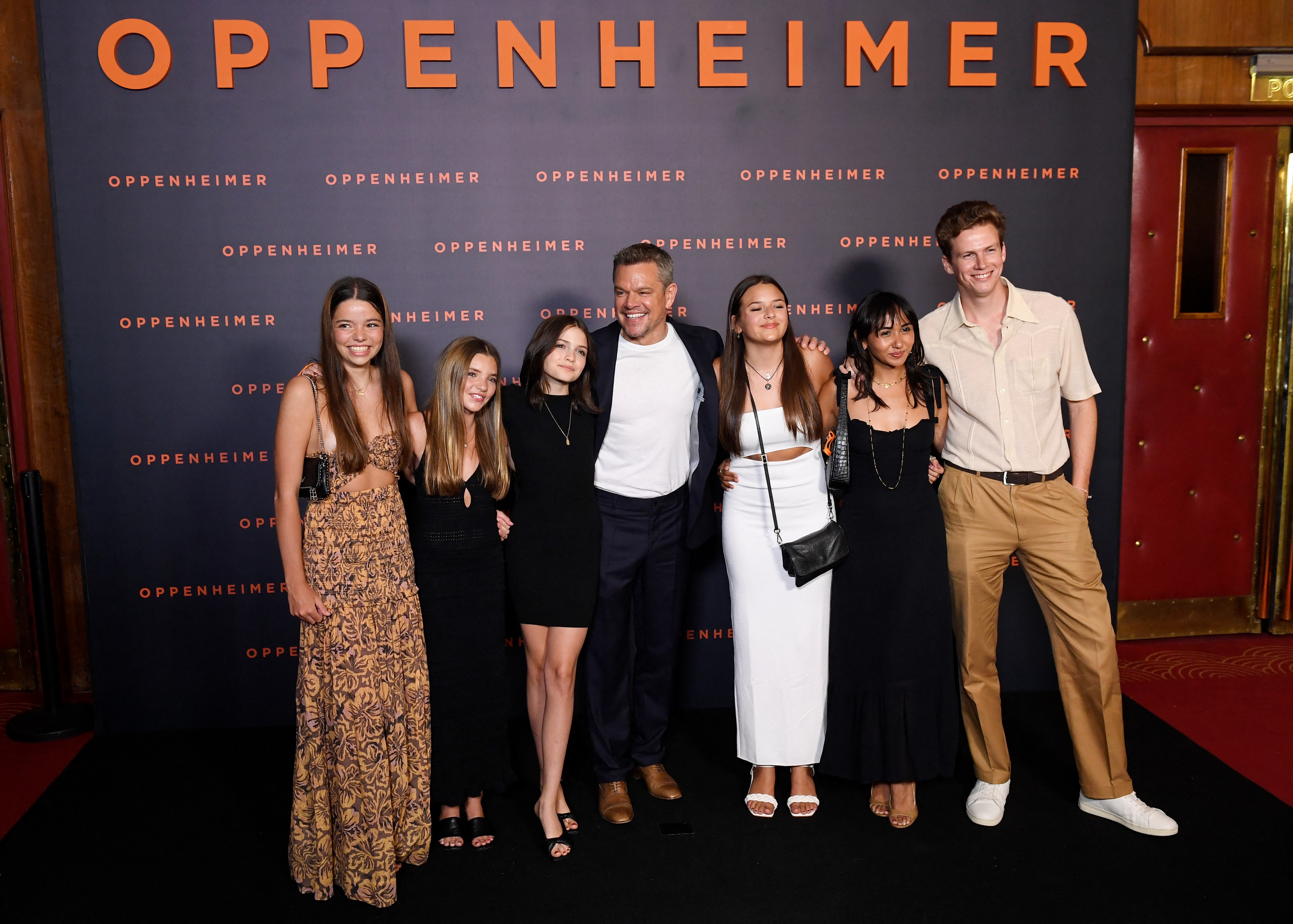 Matt Damon poses with daughters Stella Damon, Gia Damon, and Alexia Barroso at the Paris premiere of "Oppenheimer," offering a rare glimpse at how much his daughters have grown. | Source: Getty Images