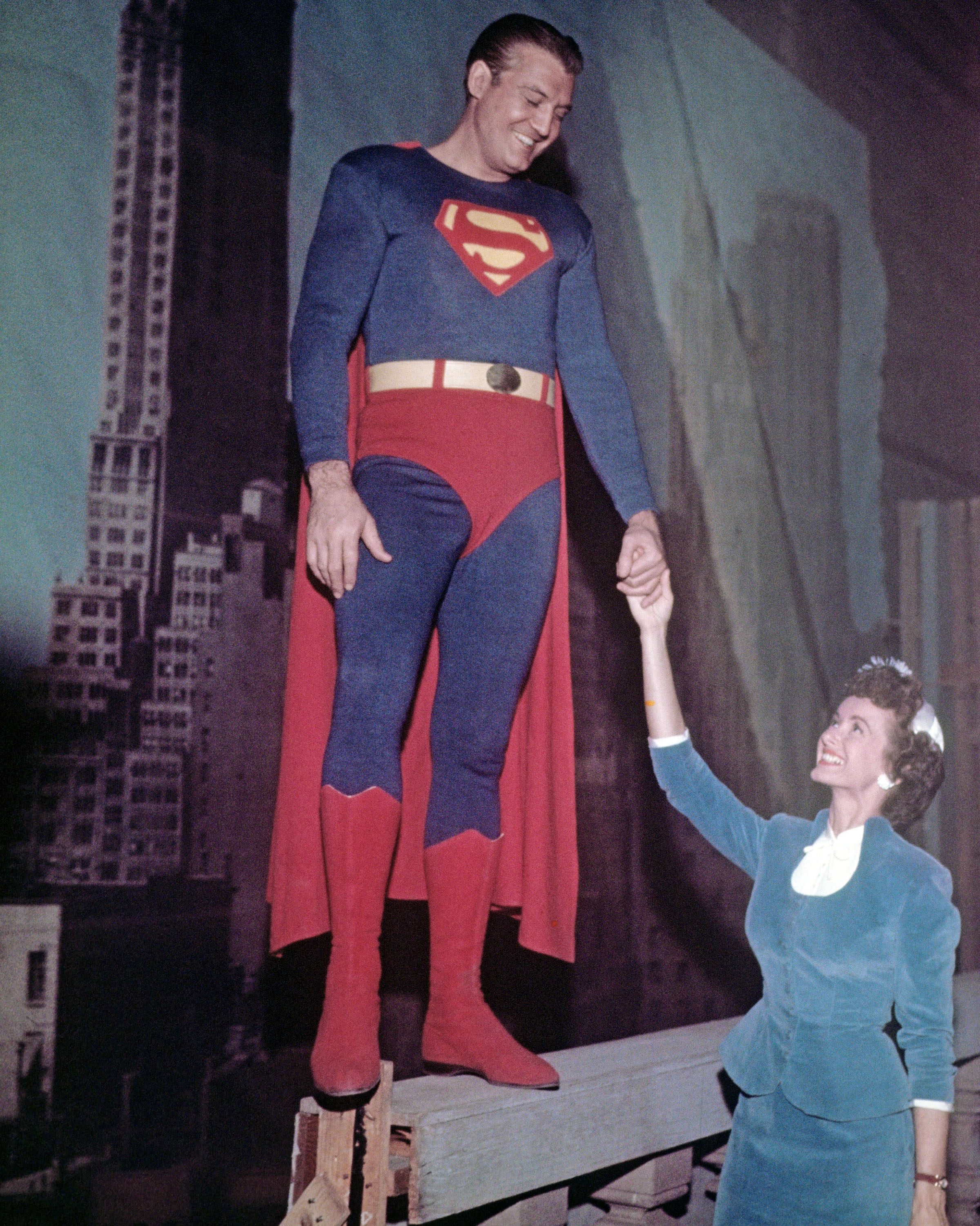 George Reeves (1914-1959), and Phyllis Coates, US actress, smile while holding hands in a publicity portrait issued for the US television series, 'Adventures of Superman', USA, circa 1952. | Source: Getty Images