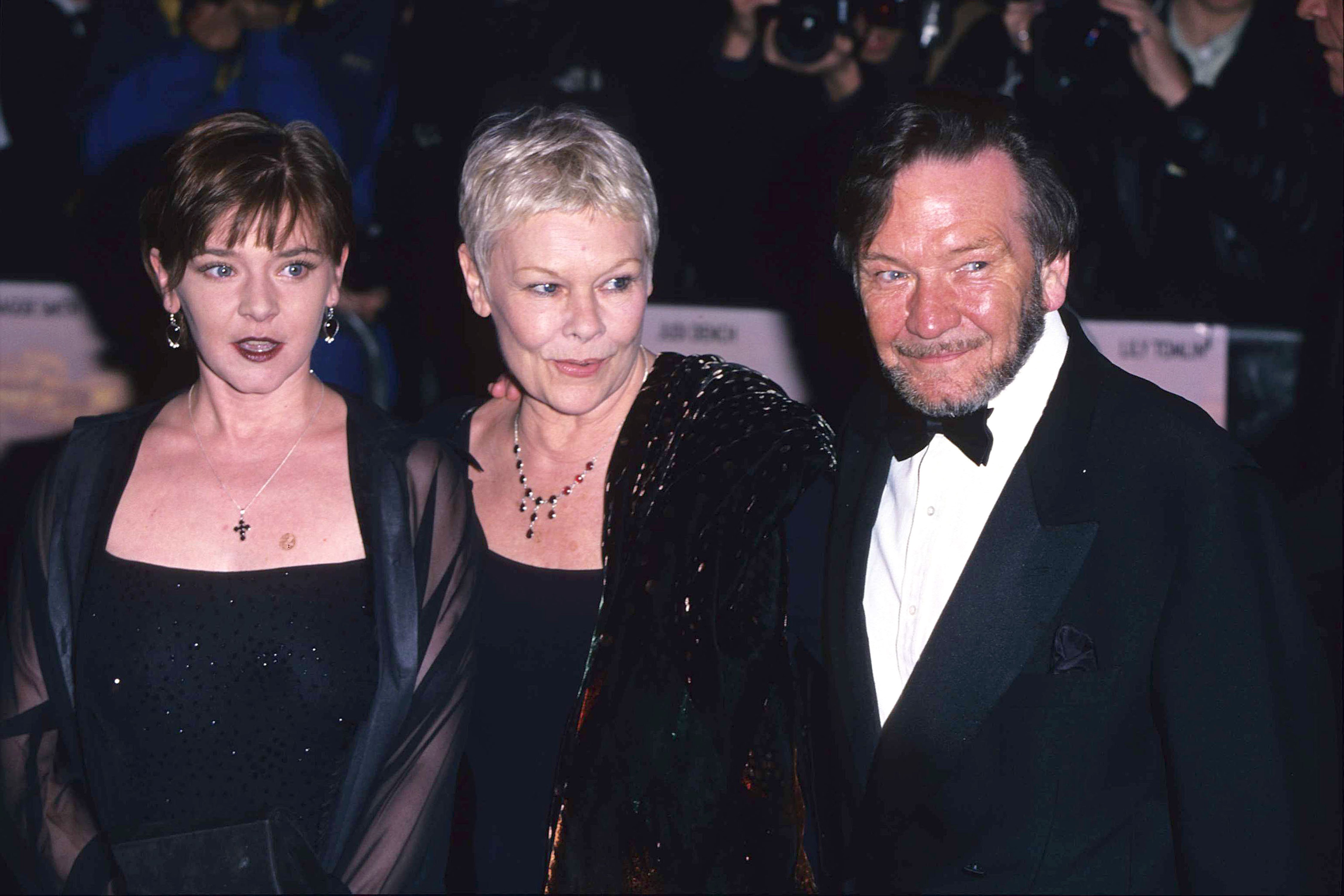 Judi Dench pictured with daughter Finty Williams and husband Michael Williams attend the "Tea with Mussolini" Royal World premiere on March 1, 1999 ┃Source: Getty Images