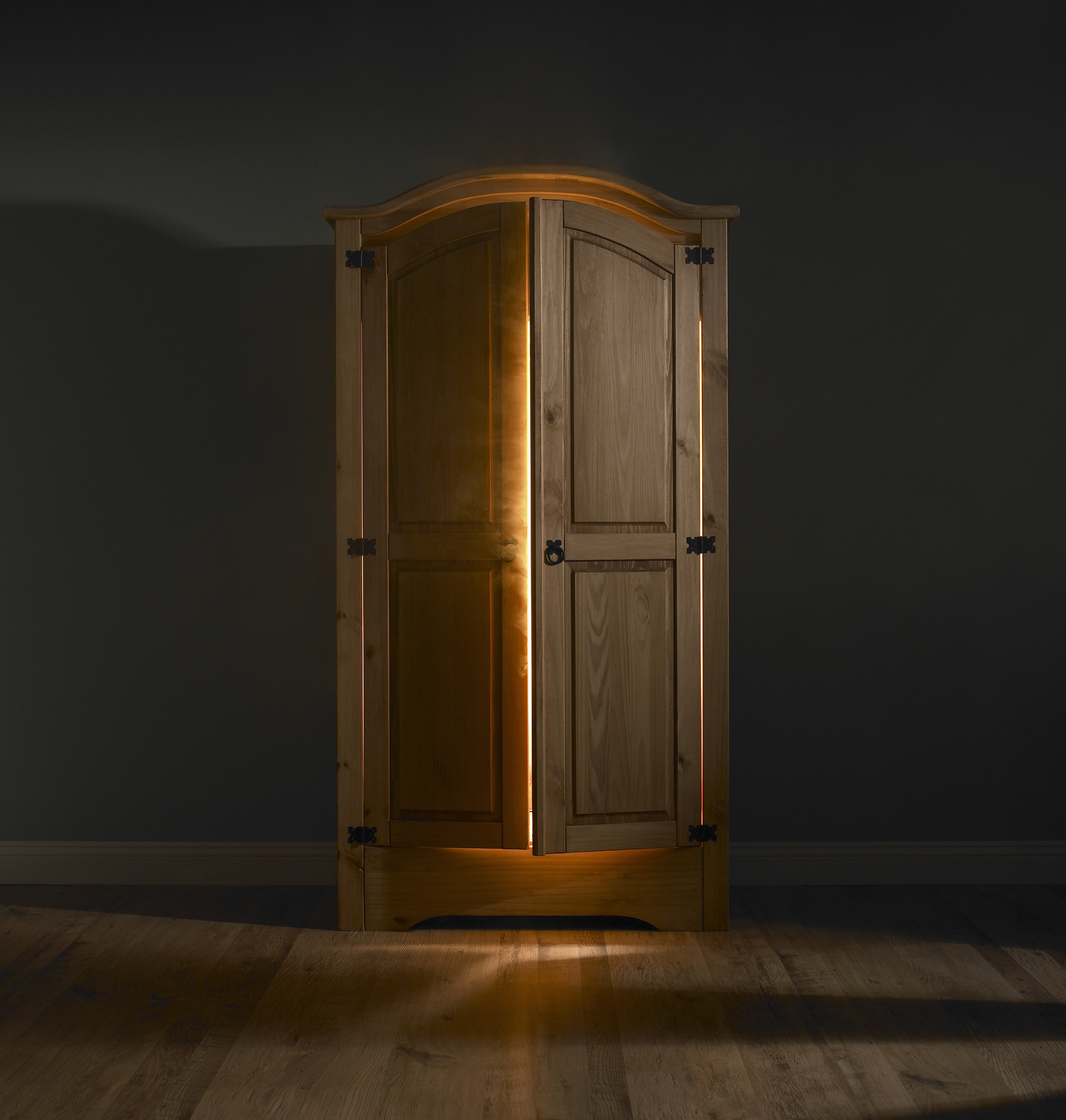 Light shining out of wardrobe door | Source: Getty Images