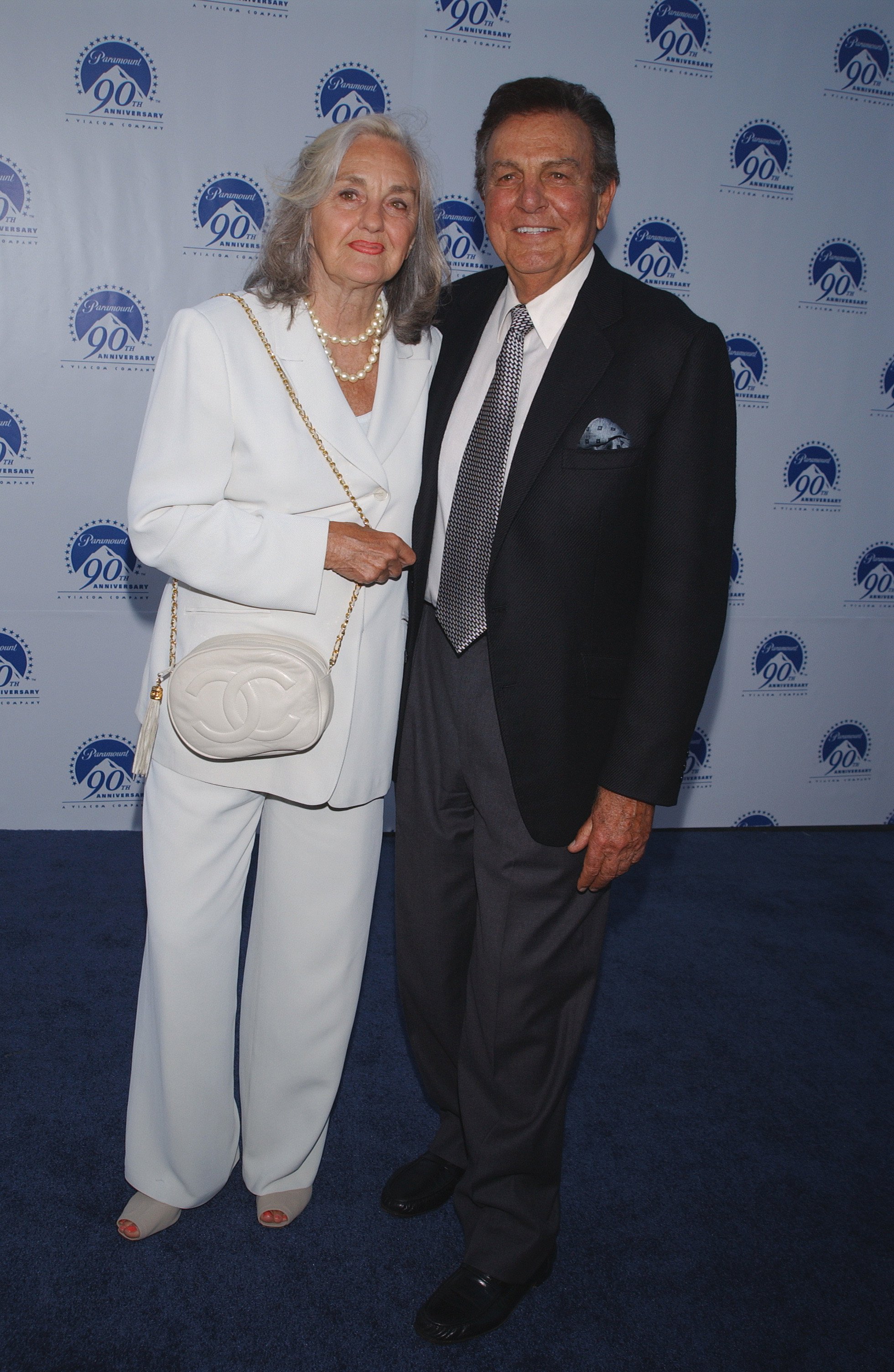 Actor Mike Connors and wife Mary Lou arriving at Paramount Pictures 90th Anniversary part on July 14 2002. | Source: Getty Images