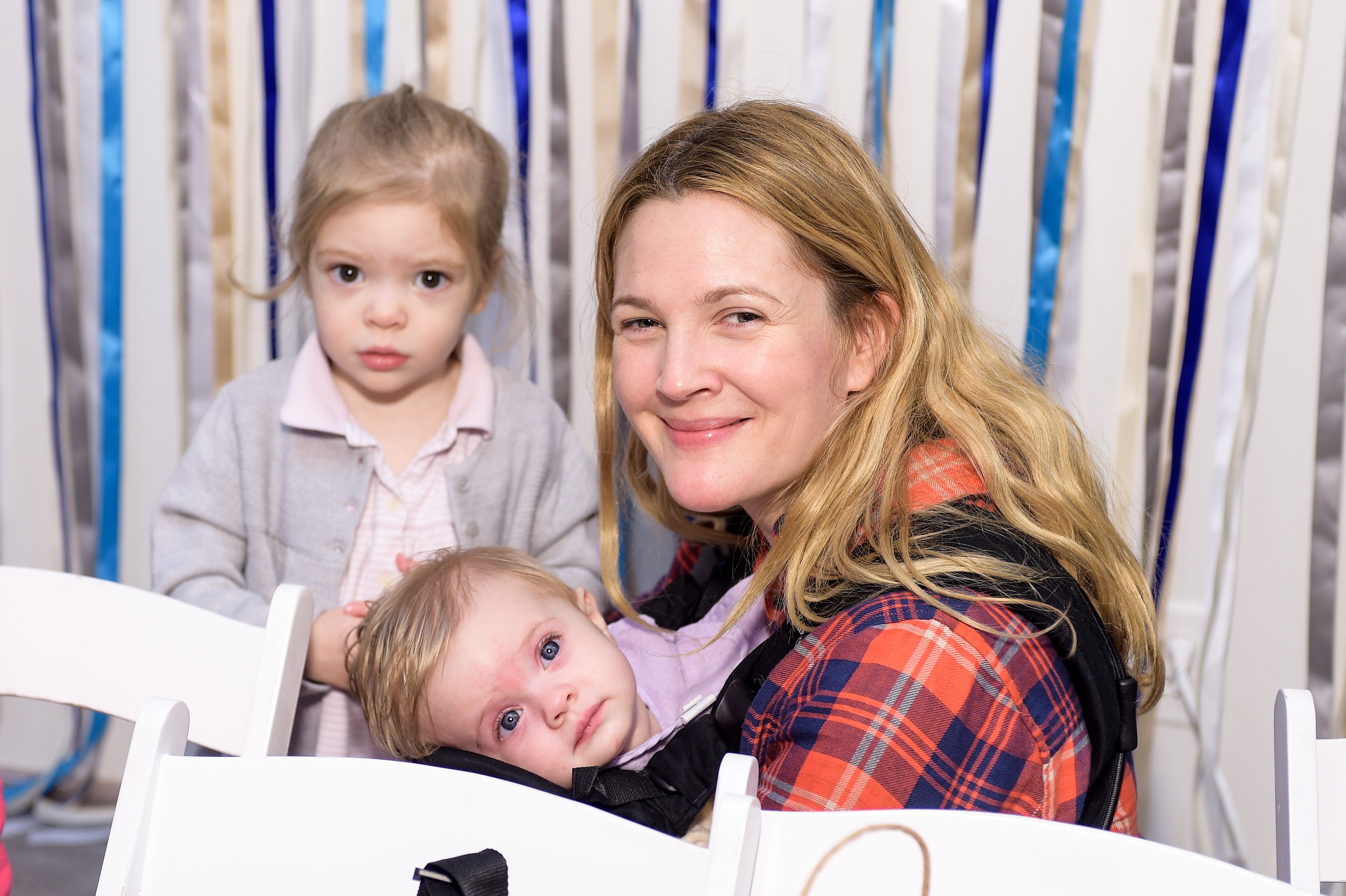 Drew Barrymore, Olive Barrymore Kopelman, and Frankie Barrymore Kopelman attending Baby2Baby Holiday Party on December 13, 2014 in Los Angeles, California. / Source: Getty Images