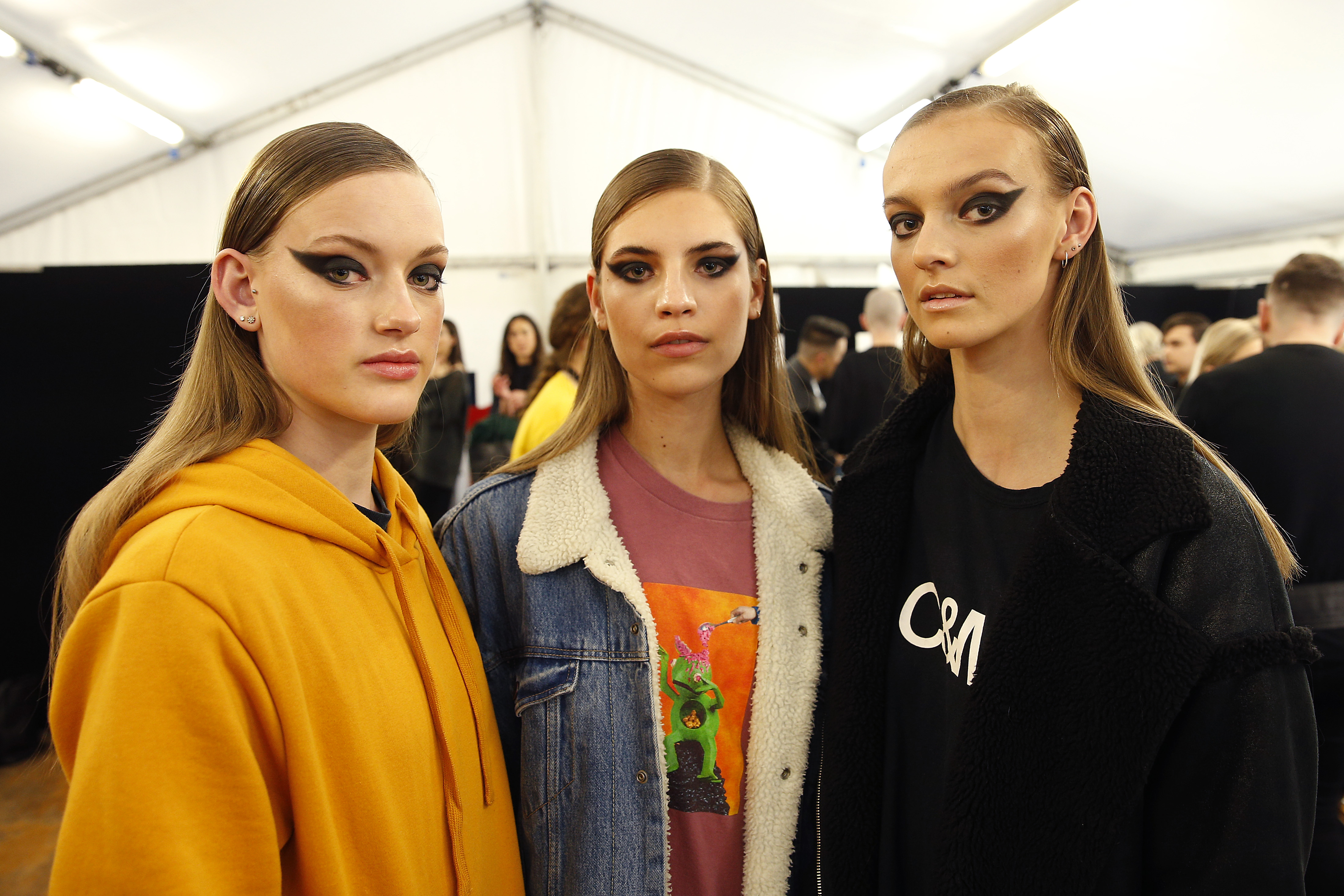 Models pose backstage in a 2019 New Zealand fashion show. | Source: Getty Images