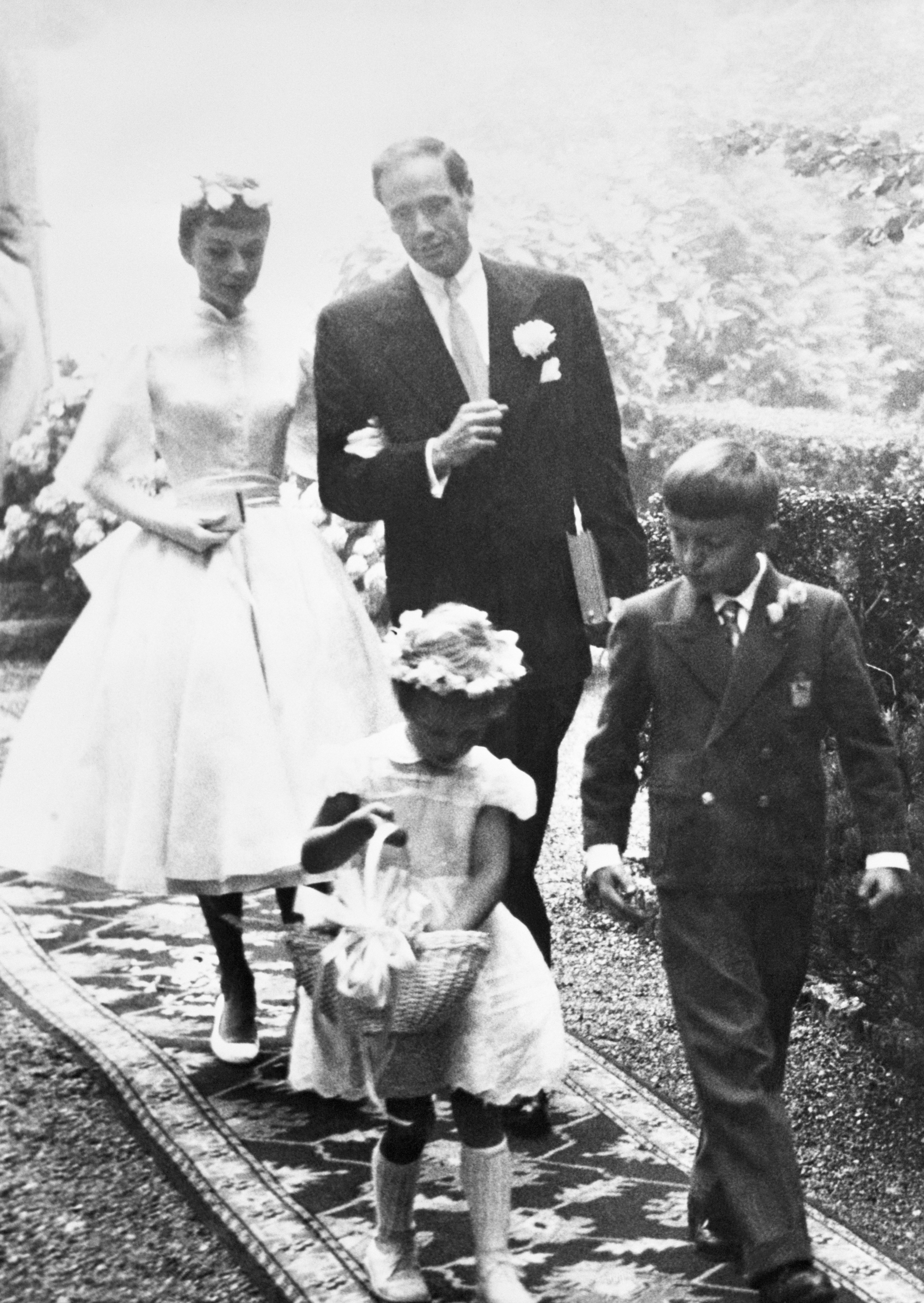 Audrey Hepburn, 25, and Mel Ferrer, 37, leave the chapel after their wedding at Burgenstock Mountain | Source: Getty Images
