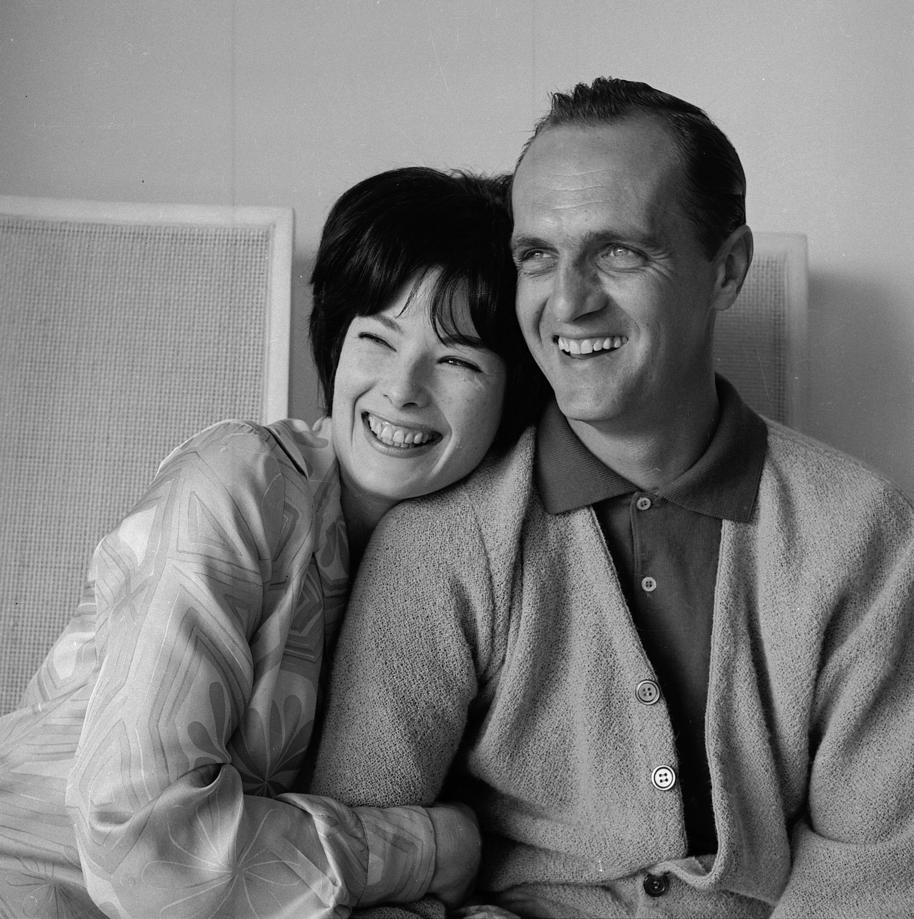 Bob Newhart and his wife Ginny laugh together at their home in Westwood, Los Angeles, California, May 21, 1964 | Source: Getty Images 