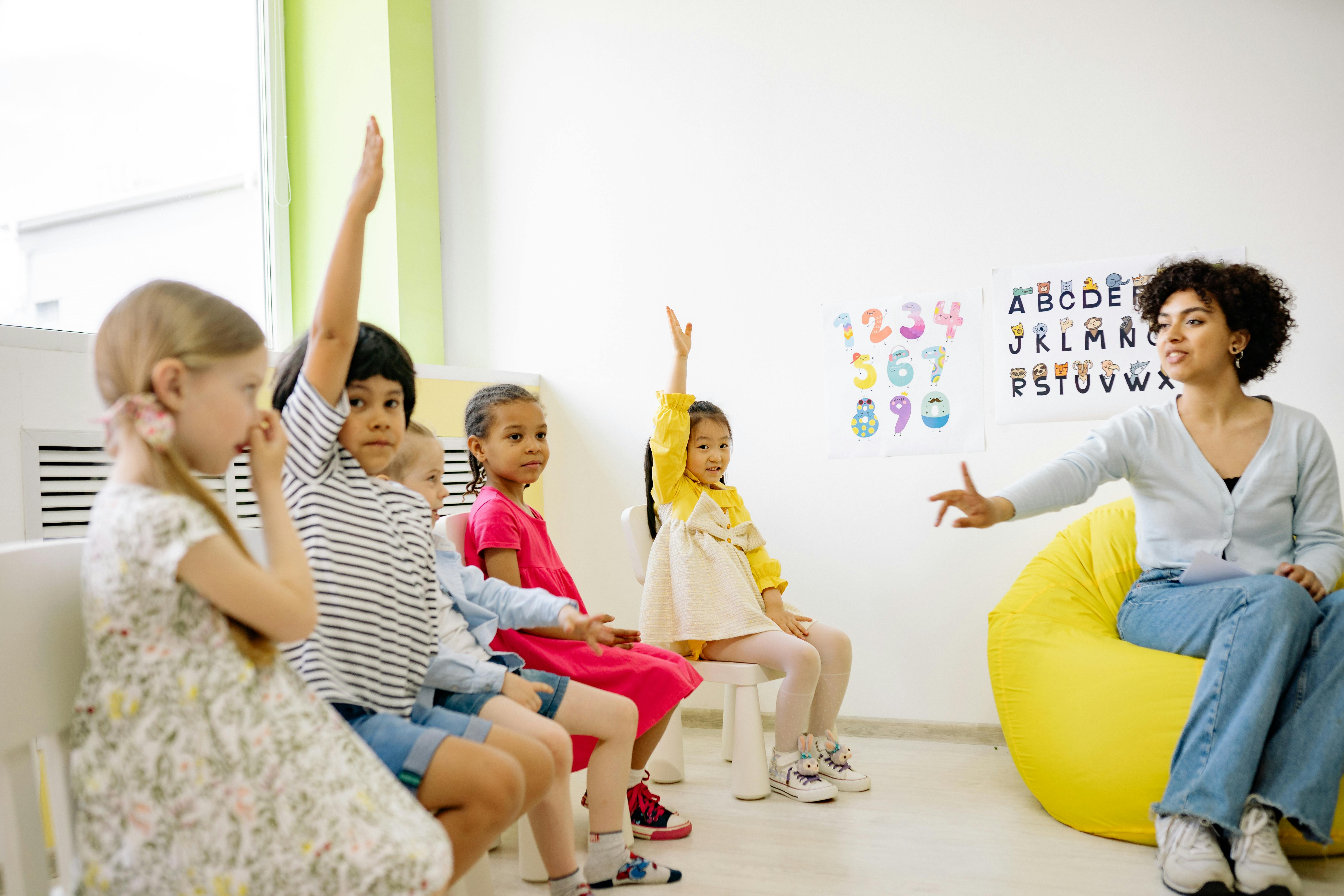 A teacher leading a class of schoolchildren | Source: Pexels