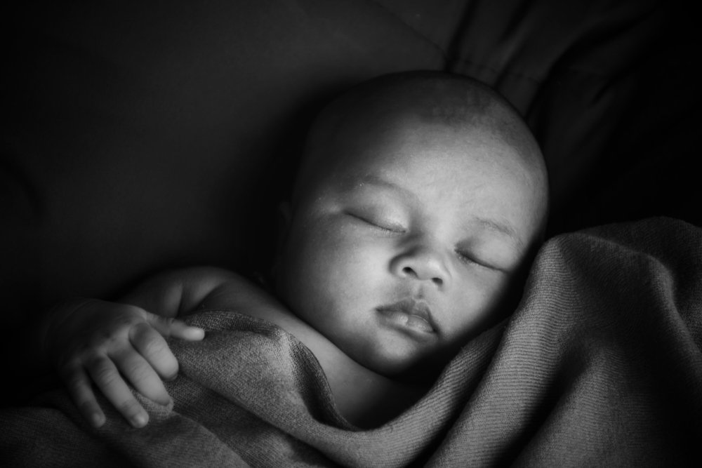 A monochrome photo of a baby | Photo: Shutterstock