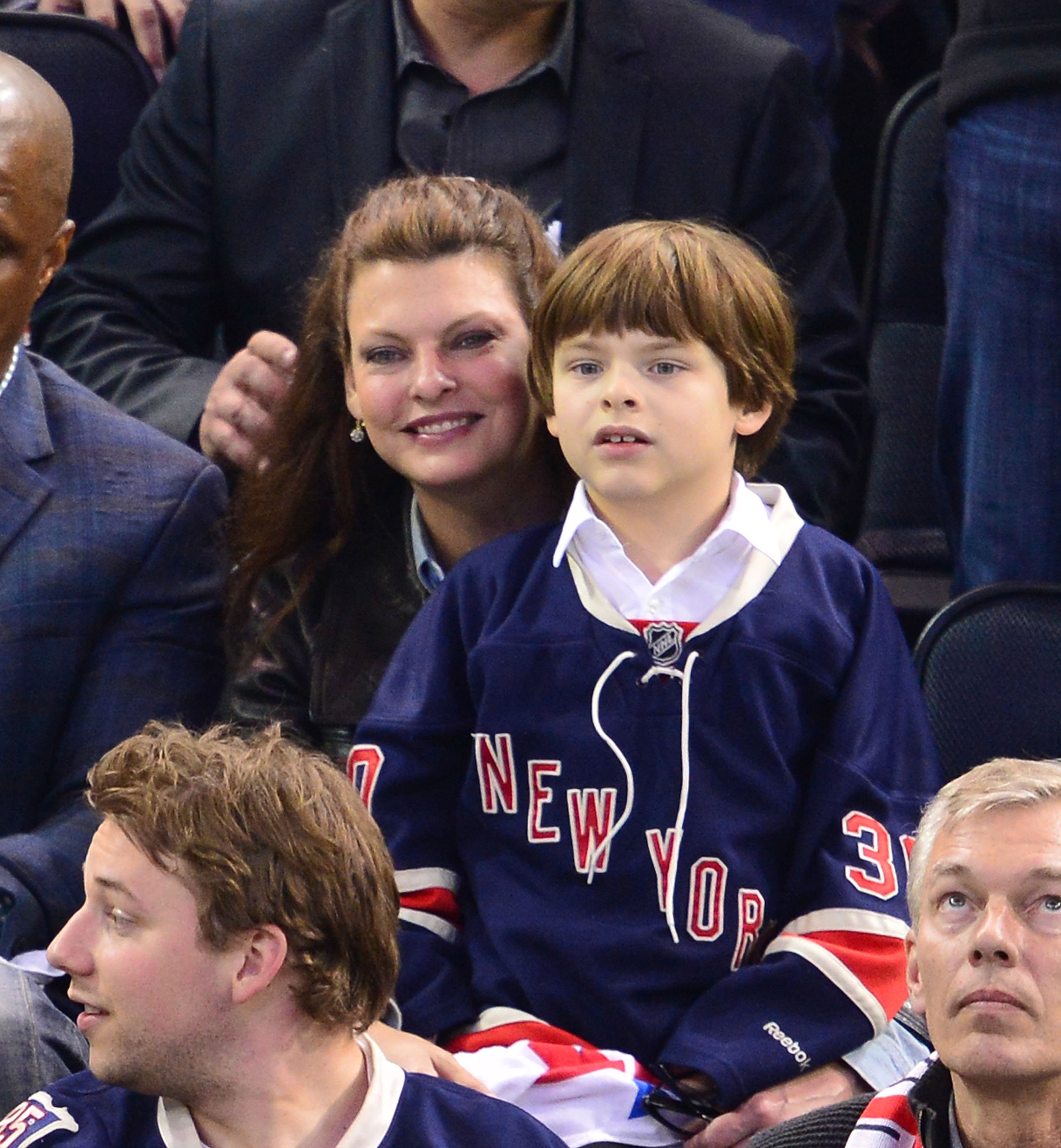 Linda Evangelista and Augustin James Evangelista at the Montreal Canadiens vs. New York Rangers playoff game on May 29, 2014 | Source: Getty Images