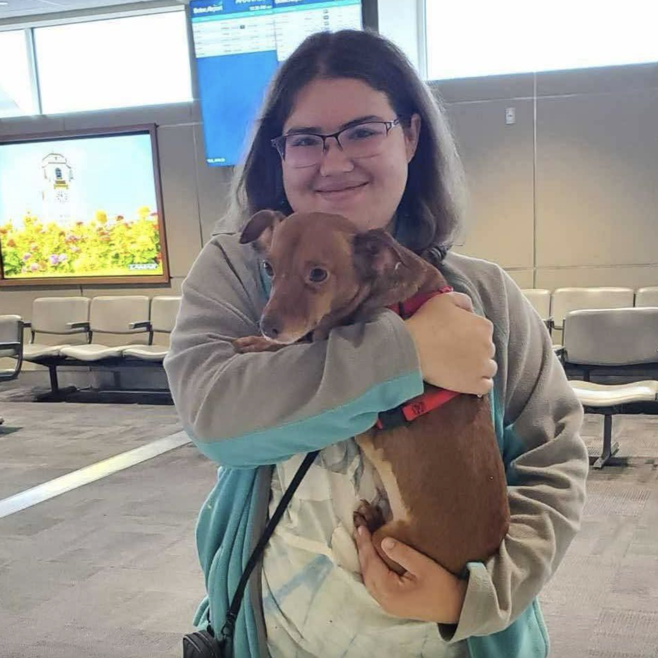 Serena Bennett smiles while holding a puppy, dated May 21, 2025 | Source: Facebook/Lakelowellanimalrescue