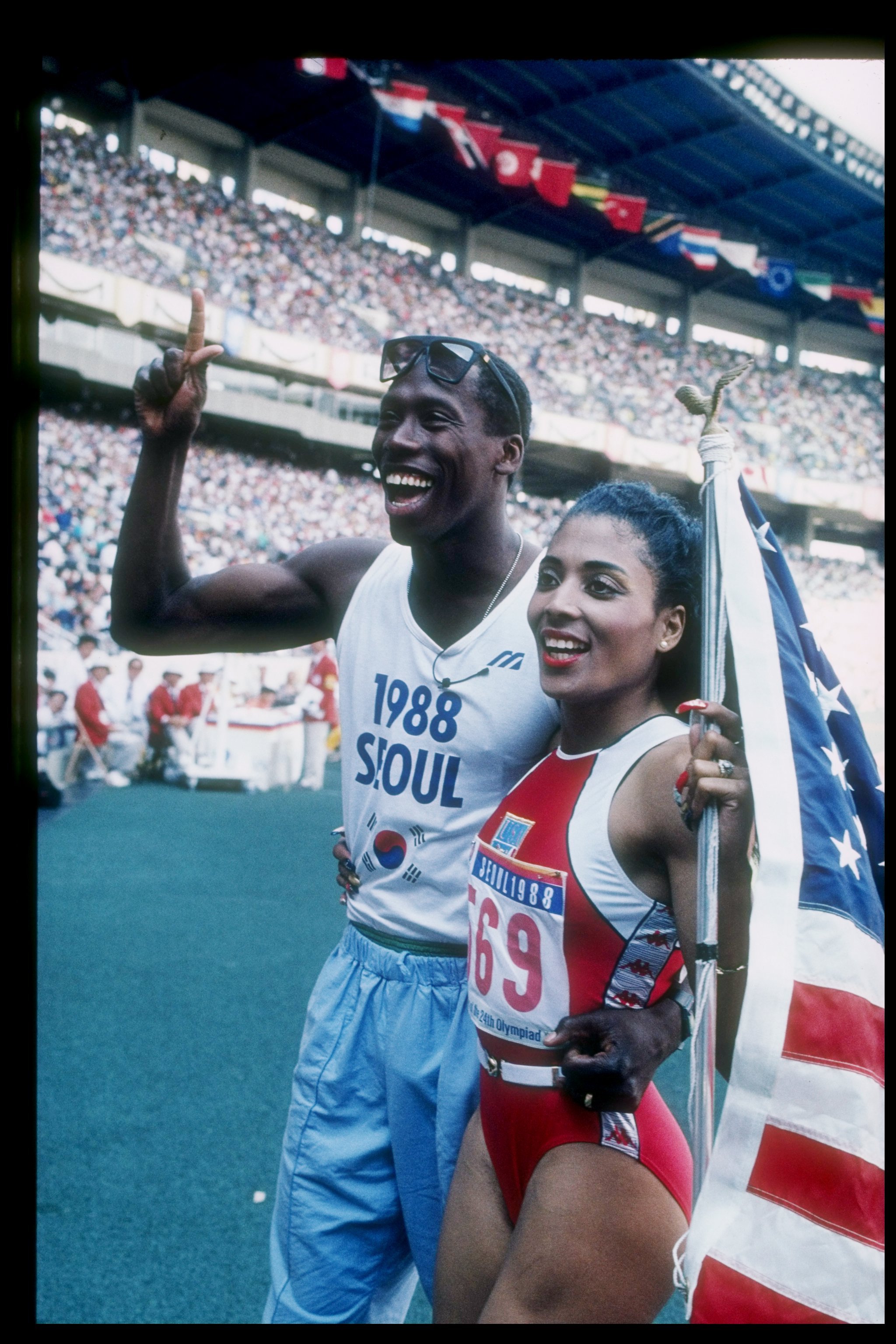 Athletes Florence Griffith-Joyner and husband Al Joyner walk off the track during the Olympic Games in Seoul South Korea in 1988 | Source: Getty Images 