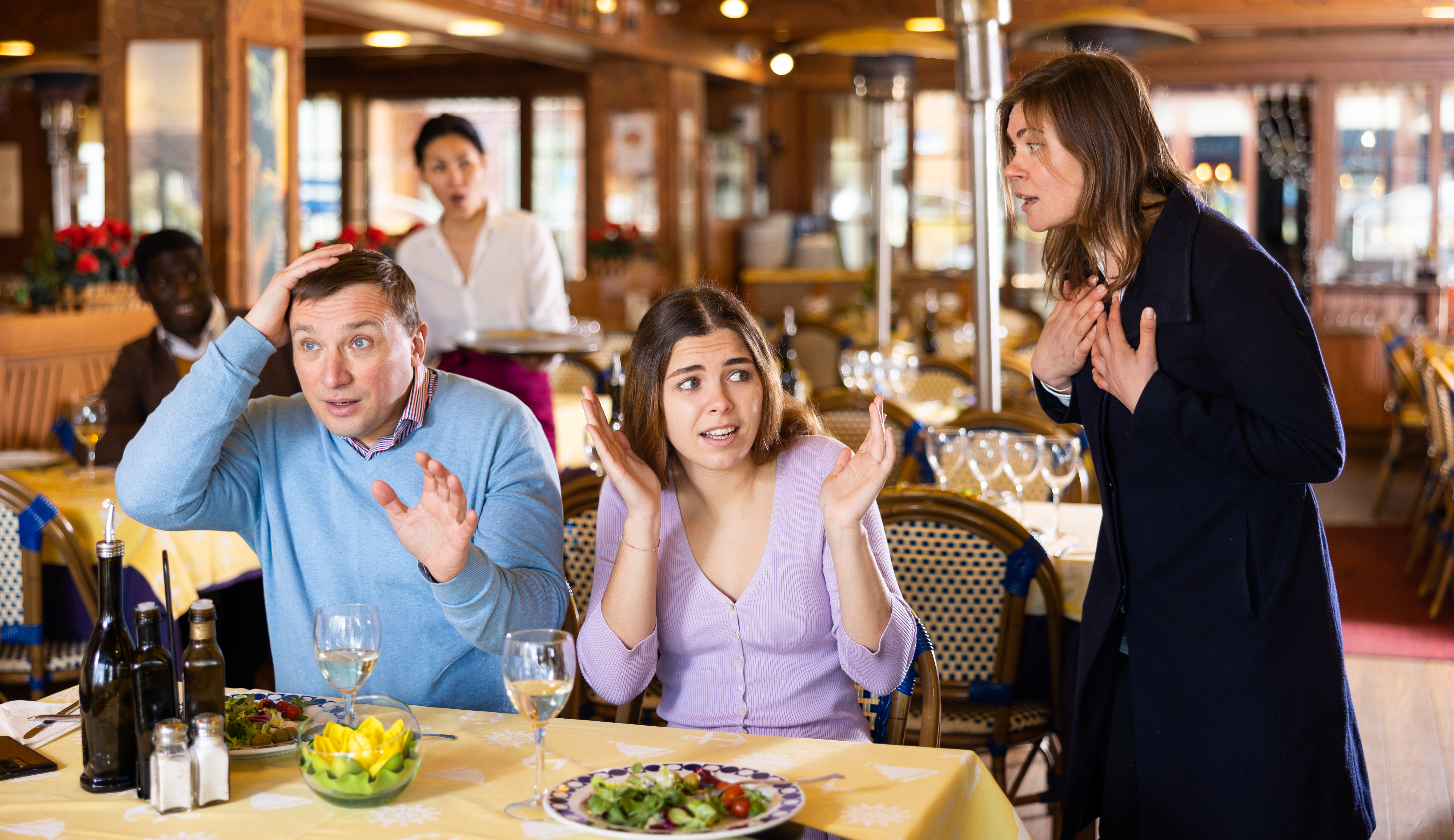 People arguing in a restaurant | Source: Getty Images