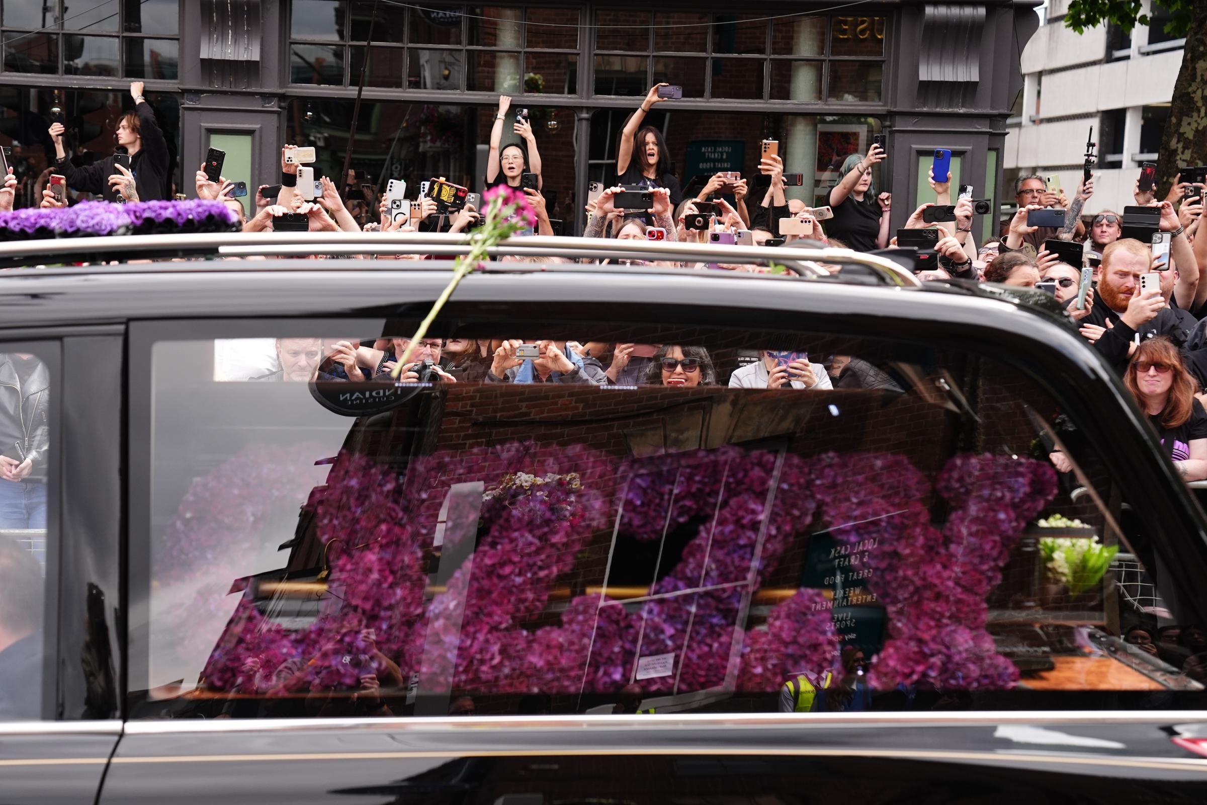 Funeral cortege for Ozzy Osbourne traveling on Birmingham's Broad Street during his funeral procession on July 30, 2025. | Source: Getty Images