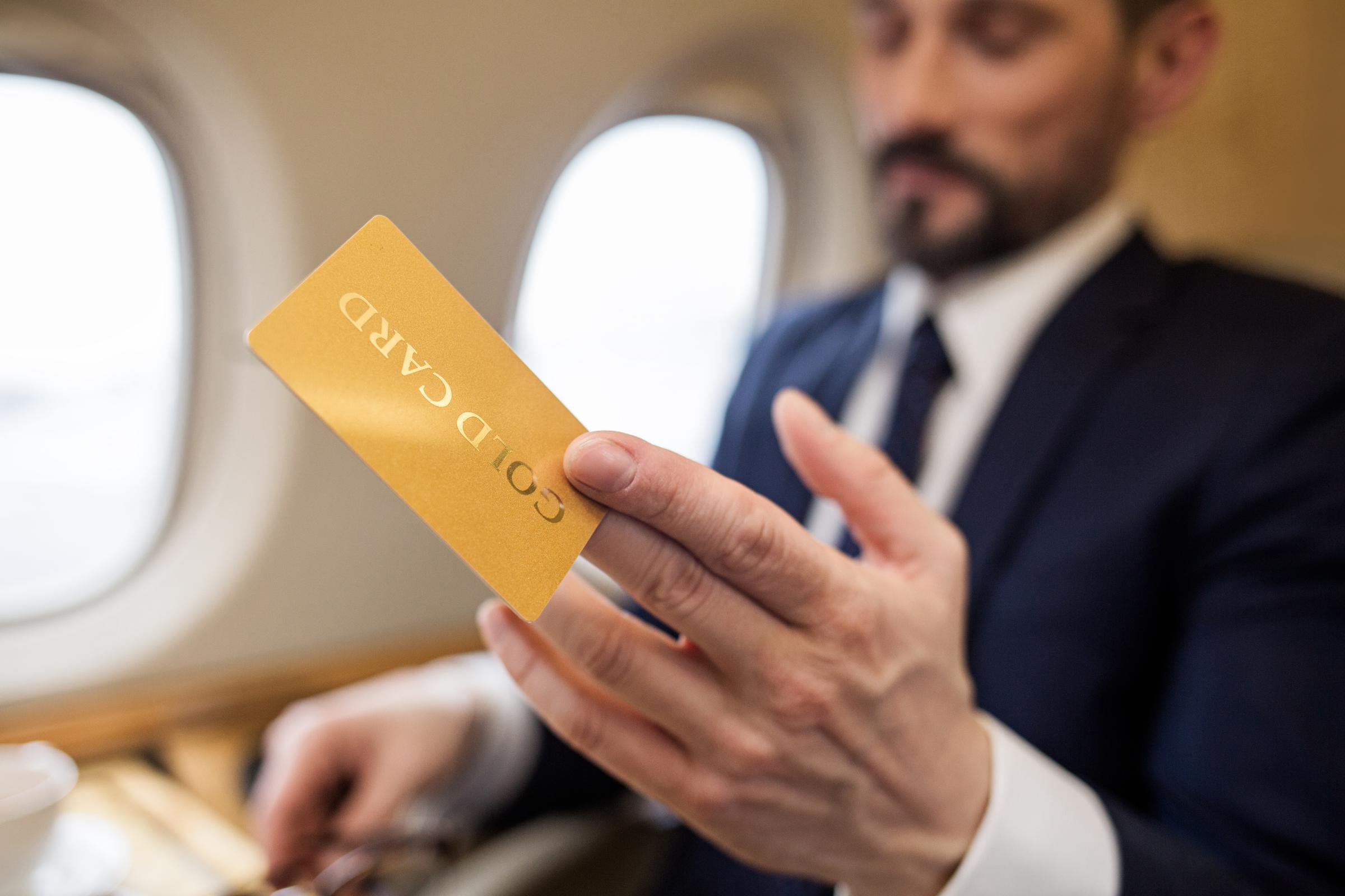 Businessman holding a gold card | Source: Shutterstock