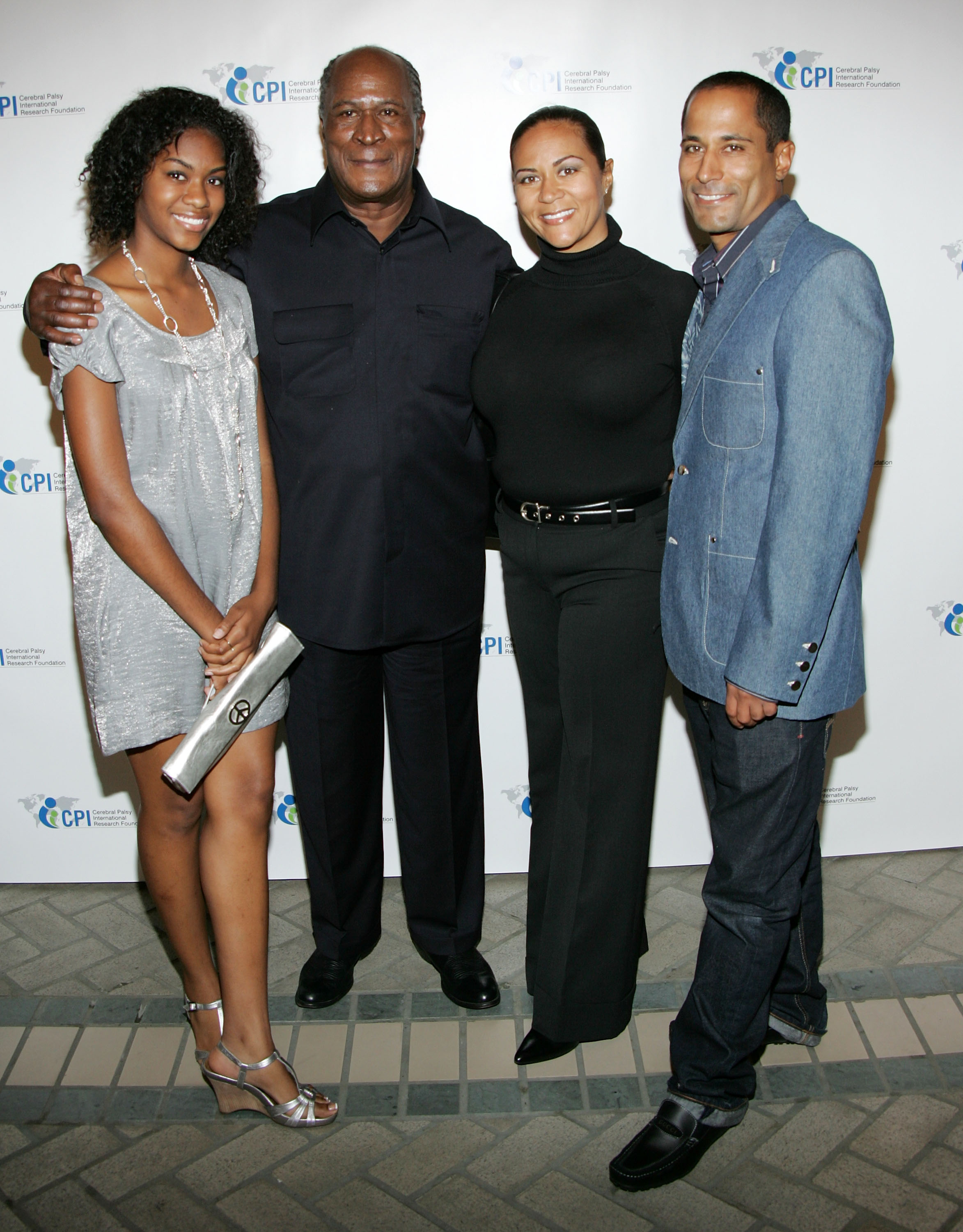 John Amos with his children, Shannon and K. C., and his granddaughter, Quiera Williams, dated December 3, 2008 | Source: Getty Images